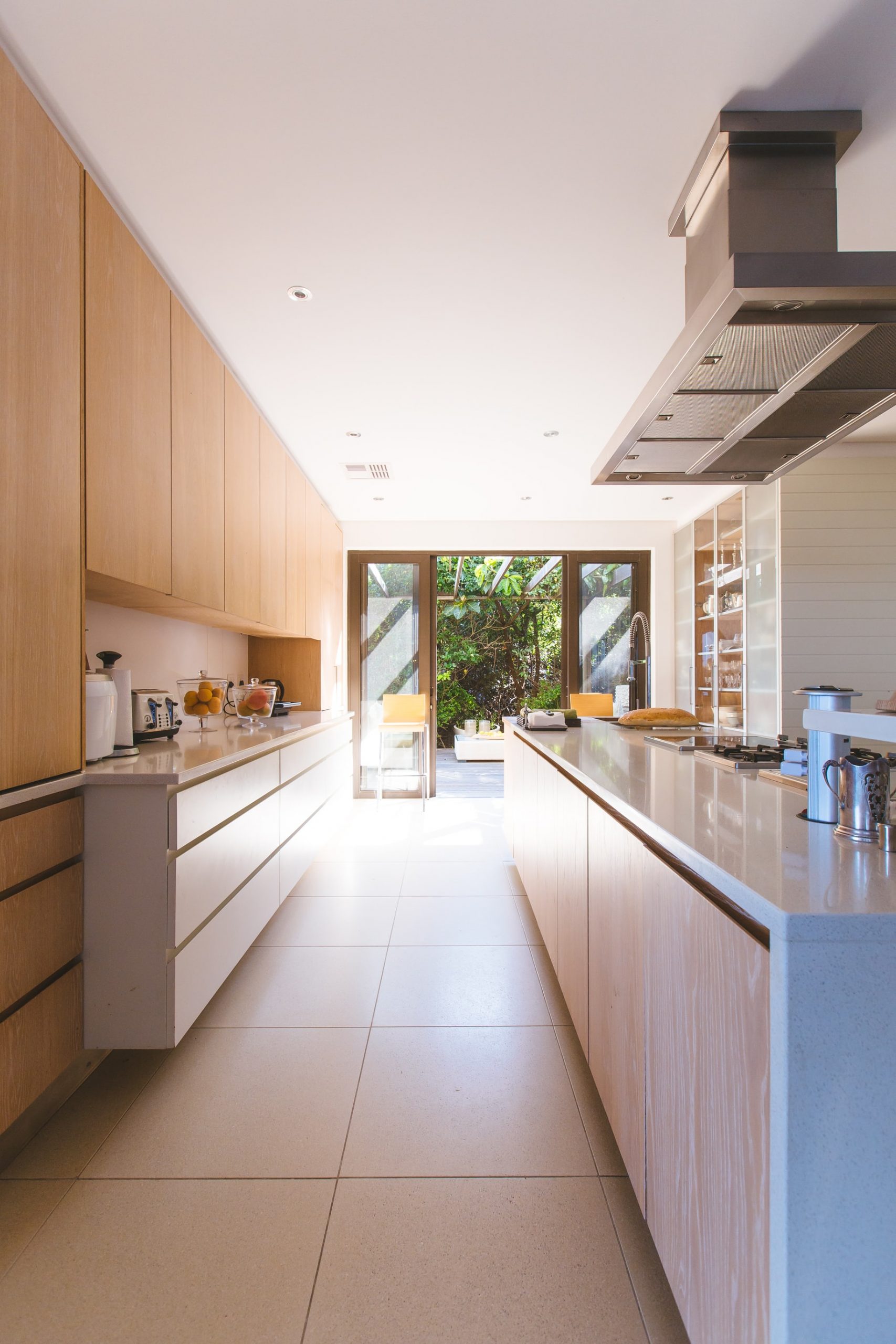 A galley kitchen with an extension leading into the garden.