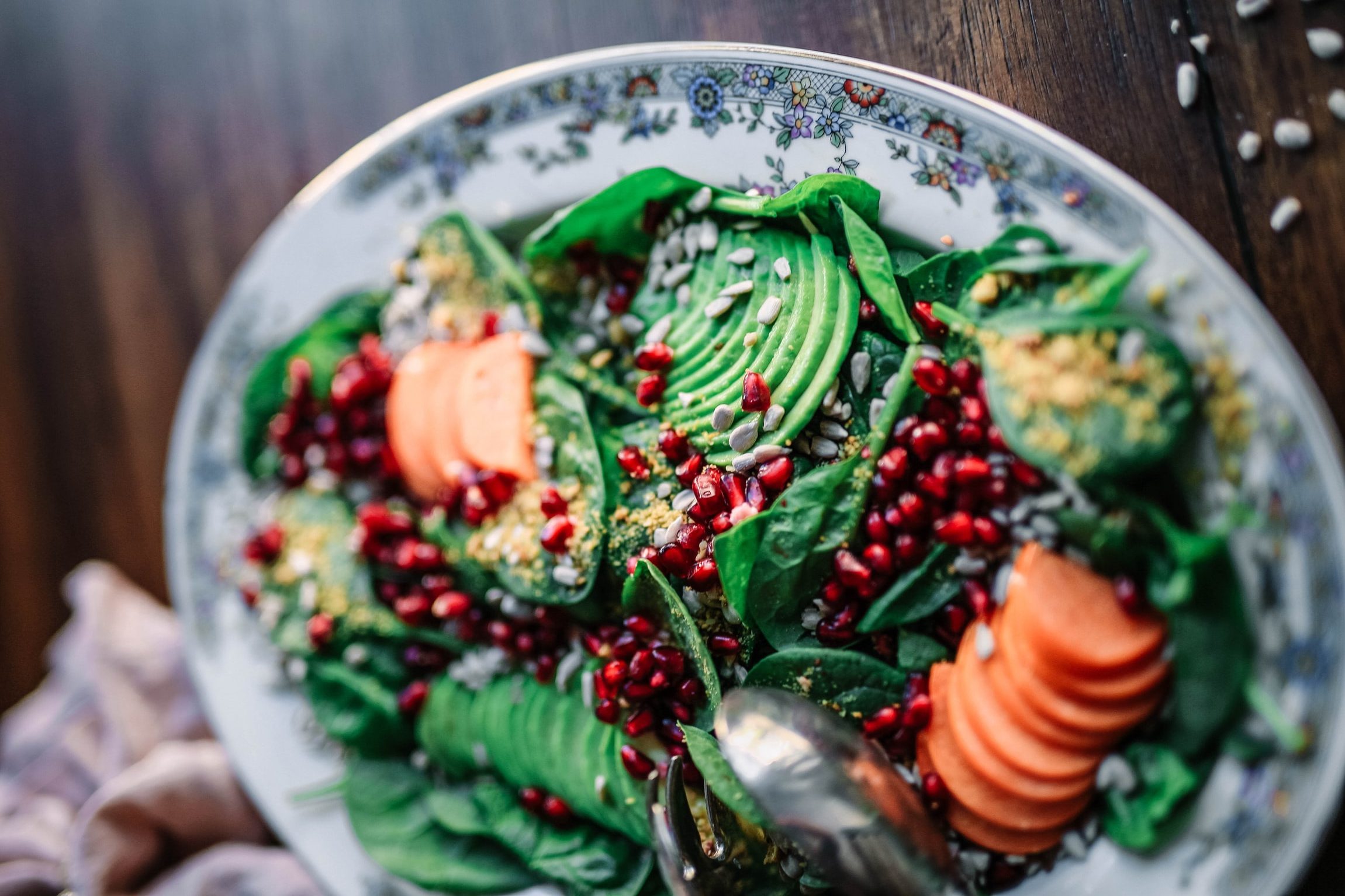 A vegan salad of Avocado, Pomegranate and Spinach