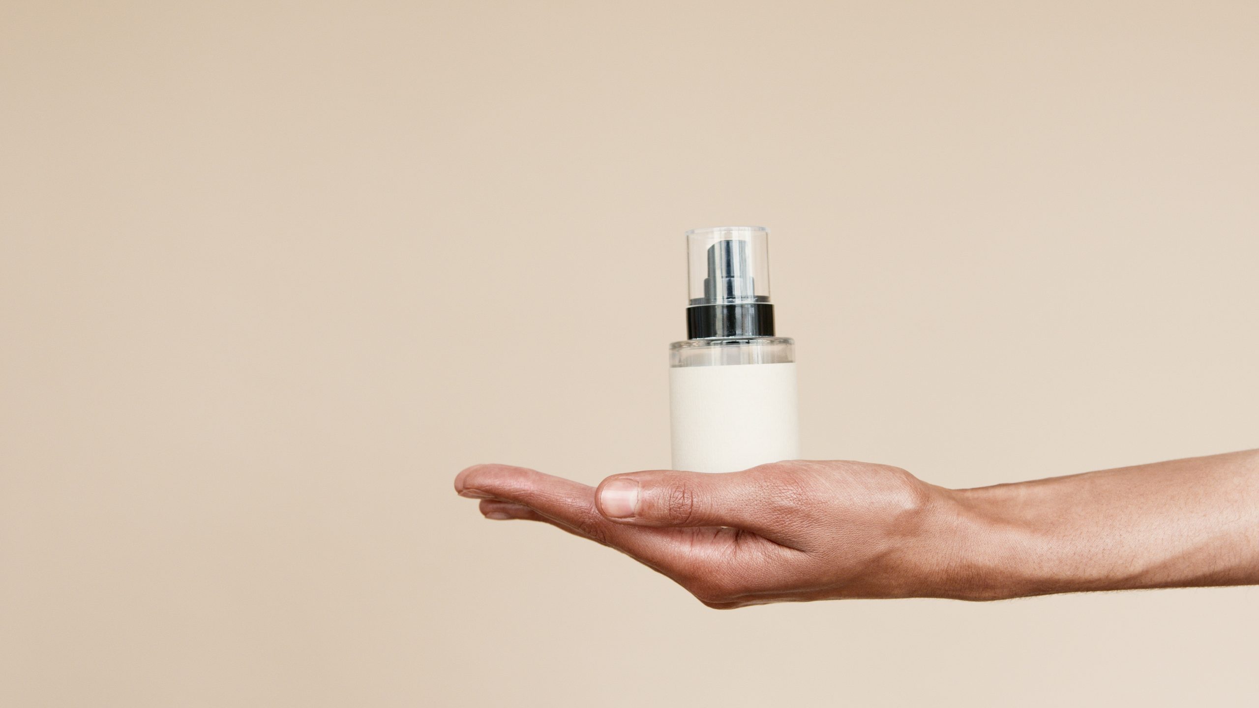 A woman holds in her hand an eco-friendly hair spray.