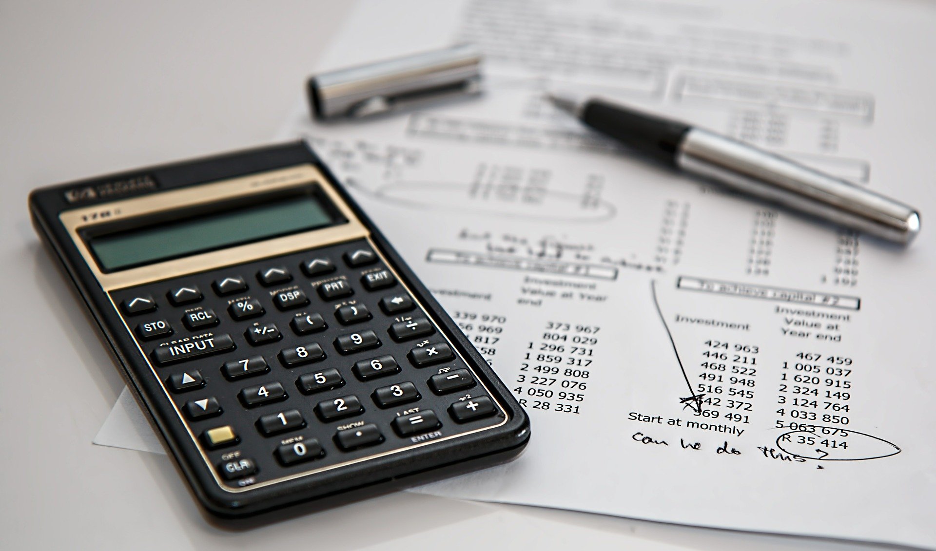 Analysing a hard copy of investments with a calculator to see if they are worth the value