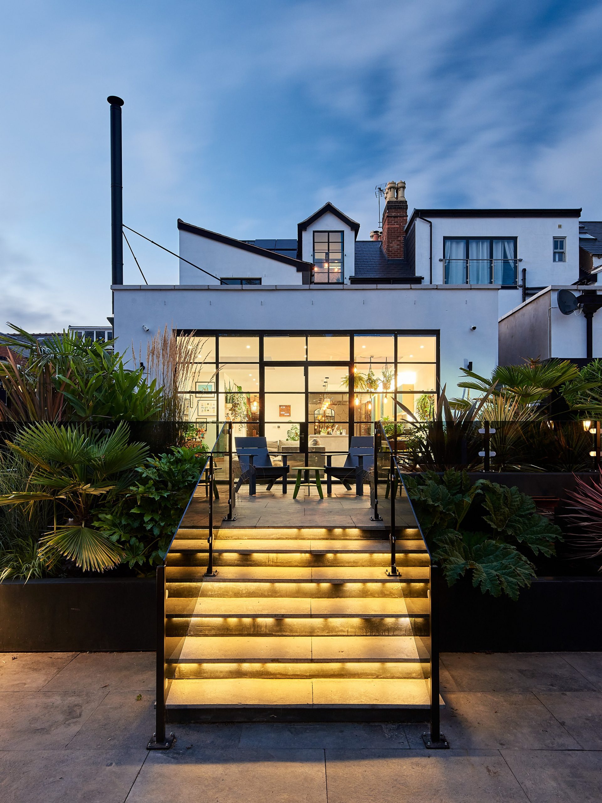 A modern living room and patio renovation by interior designers Victoria Road Restoration