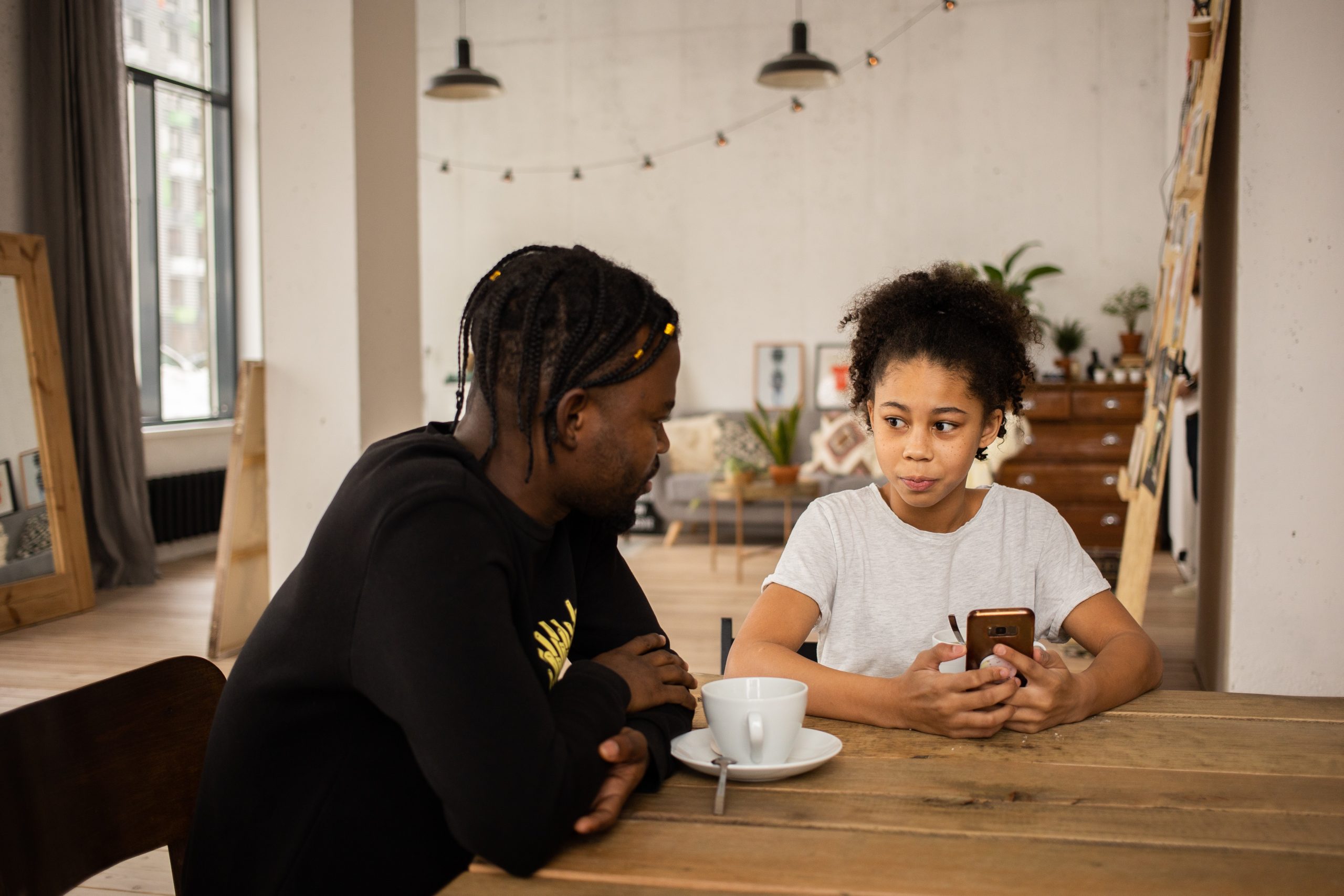 A daughter listens to her father's advice about saving for her future. 