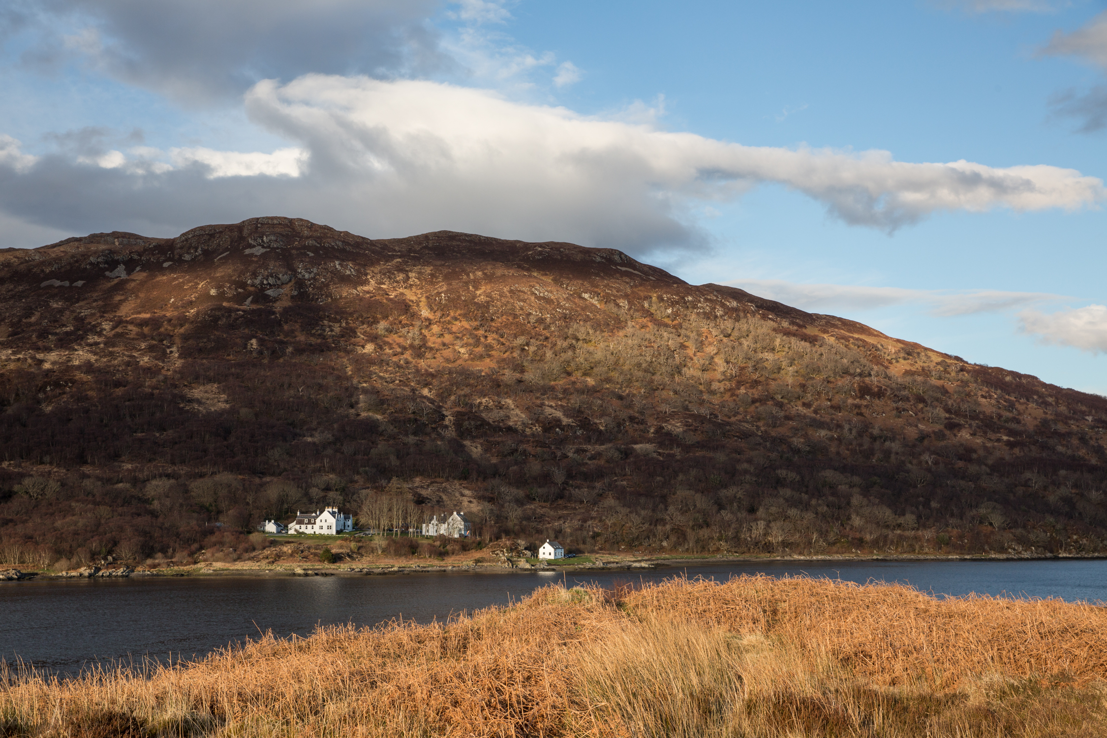 On the shores of Loch na Dal, Kinloch Lodge Hotel in Skye with the Cuillin mountains in the distance
