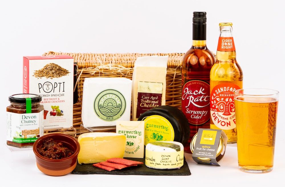 A tempting selection of cheeses and cider that come with the Devon Hampers' Cheese and Cider hamper