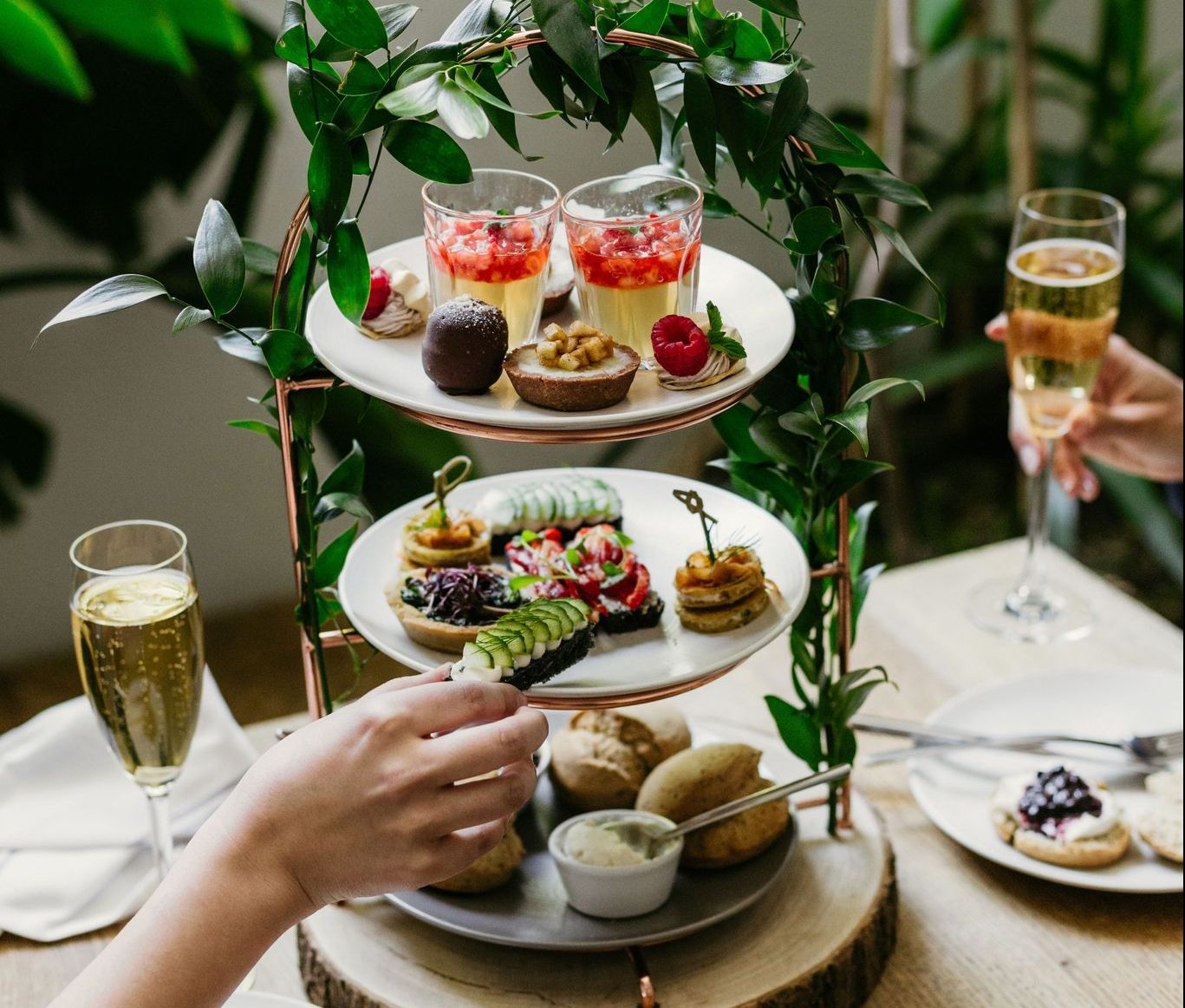 An array of savoury treats and petits gateaux in Farmacy’s bespoke High Tea.