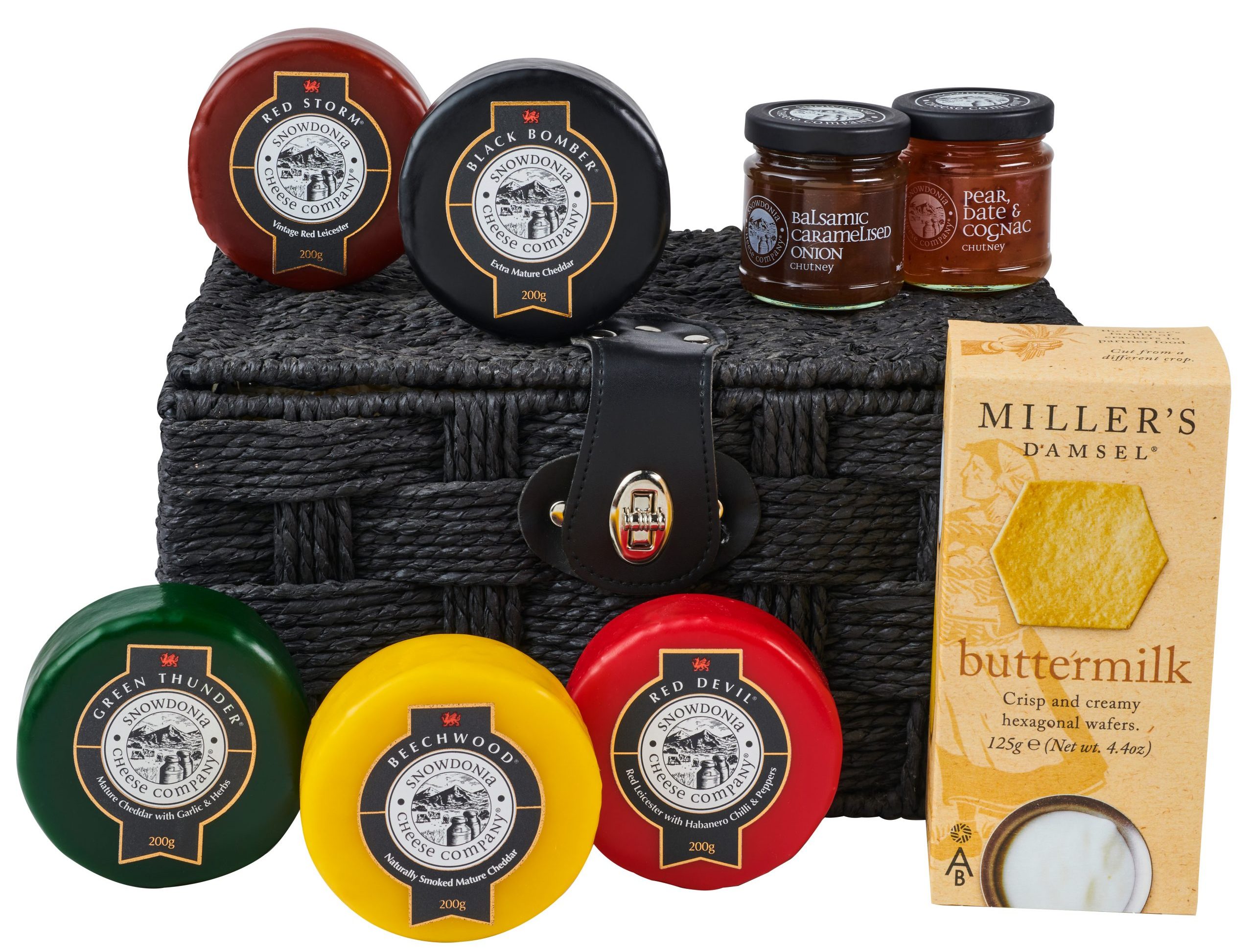 A great assortment of Snowdonia Cheese Company's cheeses, chutneys and buttermilk, next to a black hamper