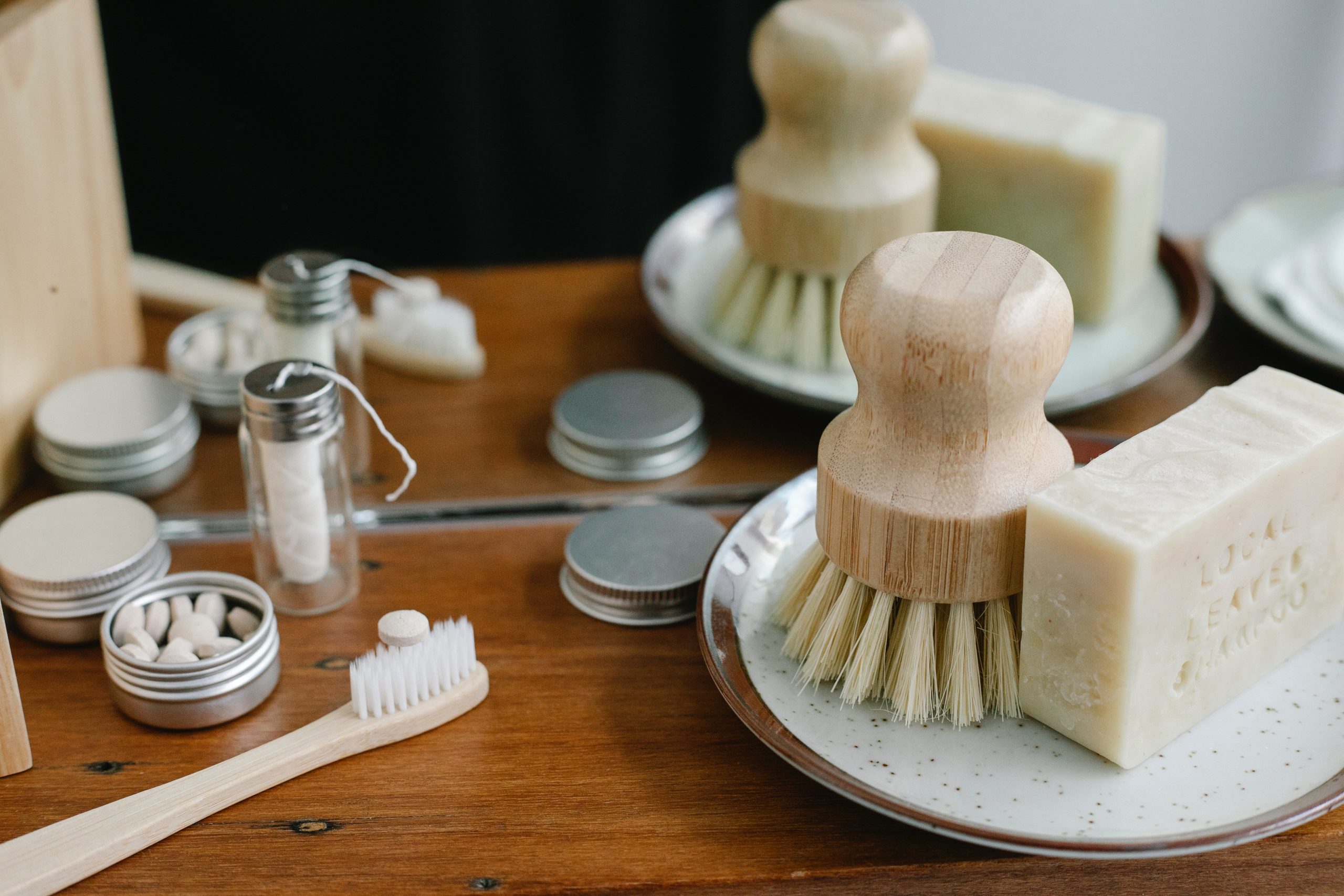 A selection of sustainable toiletries: bamboo toothbrush, reusable sanitary pads and soap.