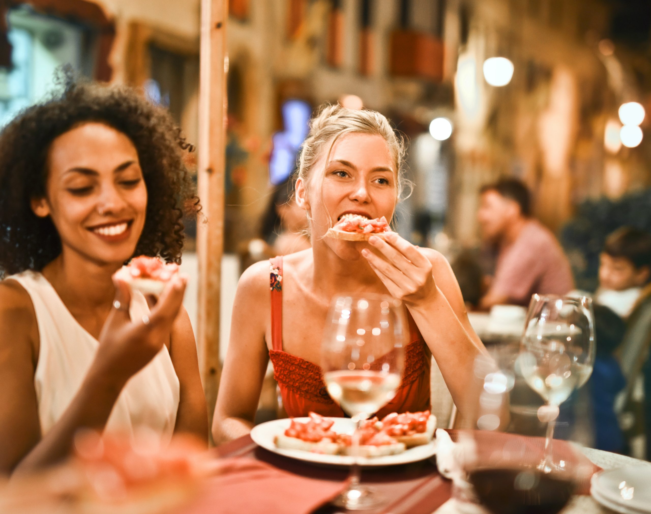 Two young women tucking in to Legally Blonde's Galentine's Brunch.