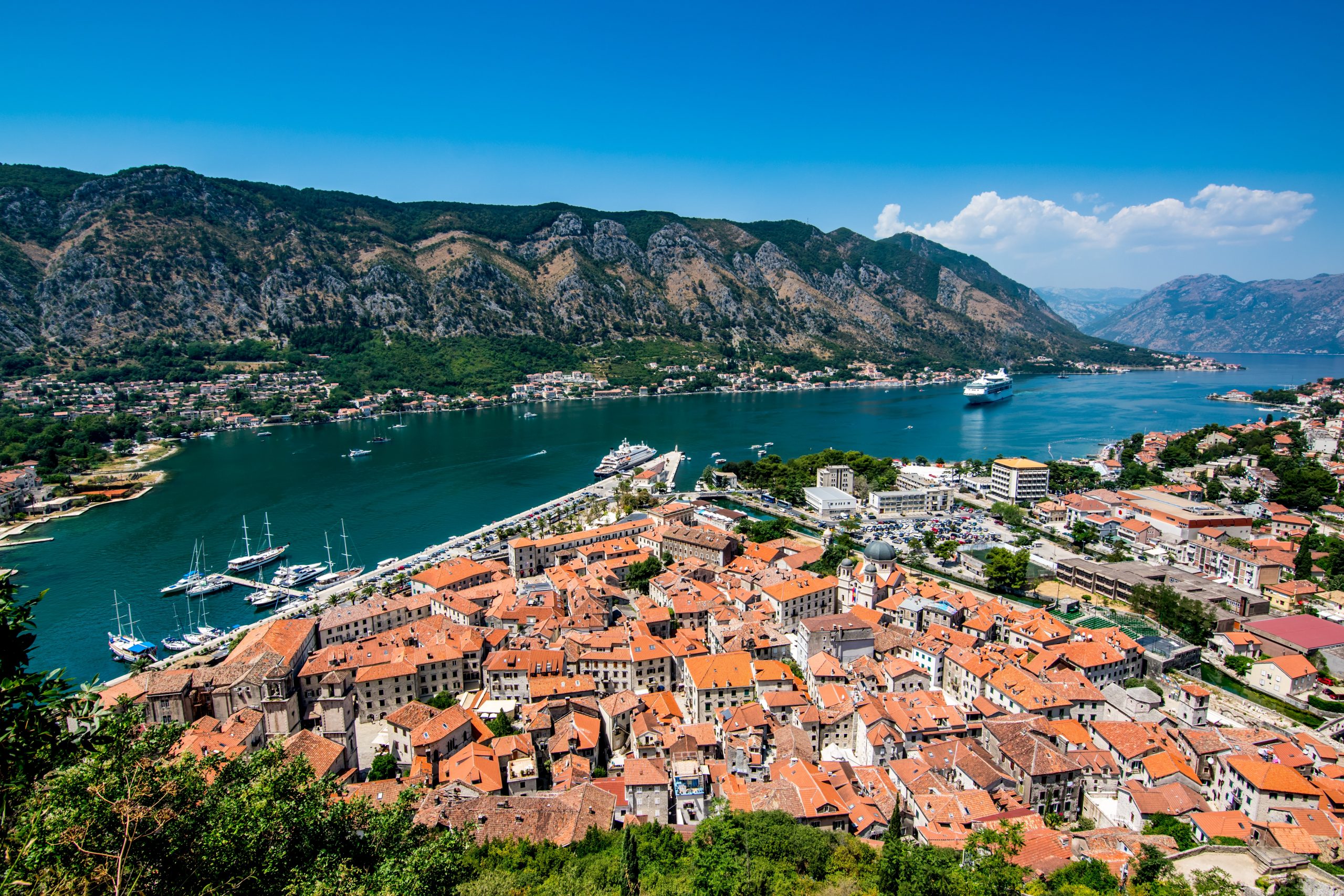 An aerial view of Kotor, Montenegro overlooking the houses, mountains and sea.