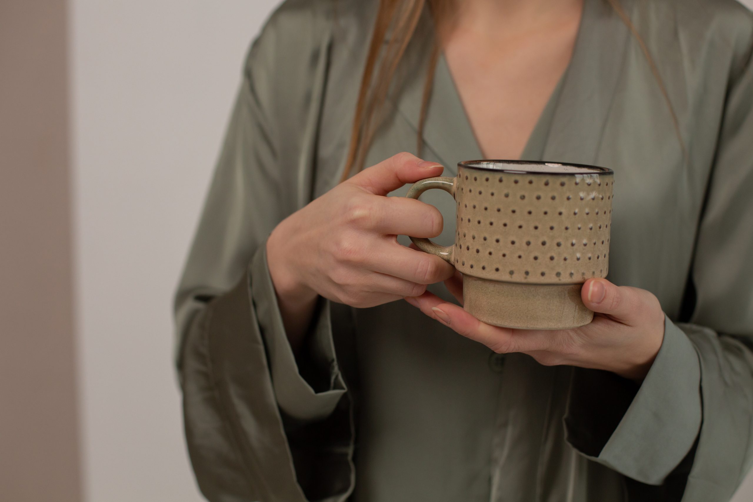 A woman unwinds with a calming chamomile tea.