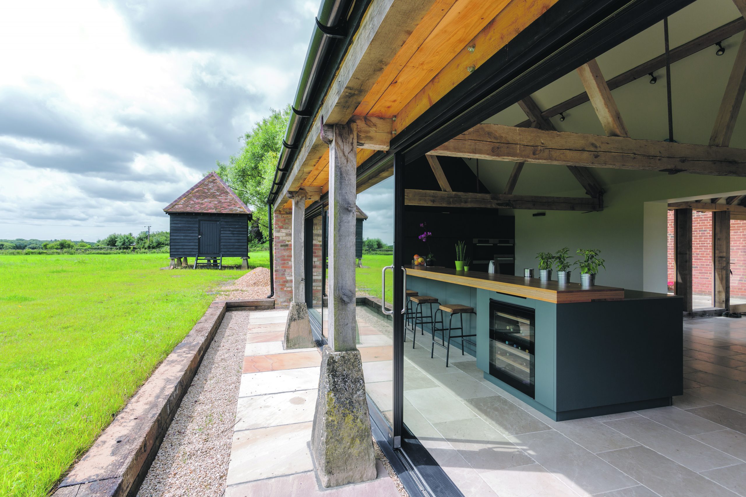 Open-air kitchen and backyard in modern home