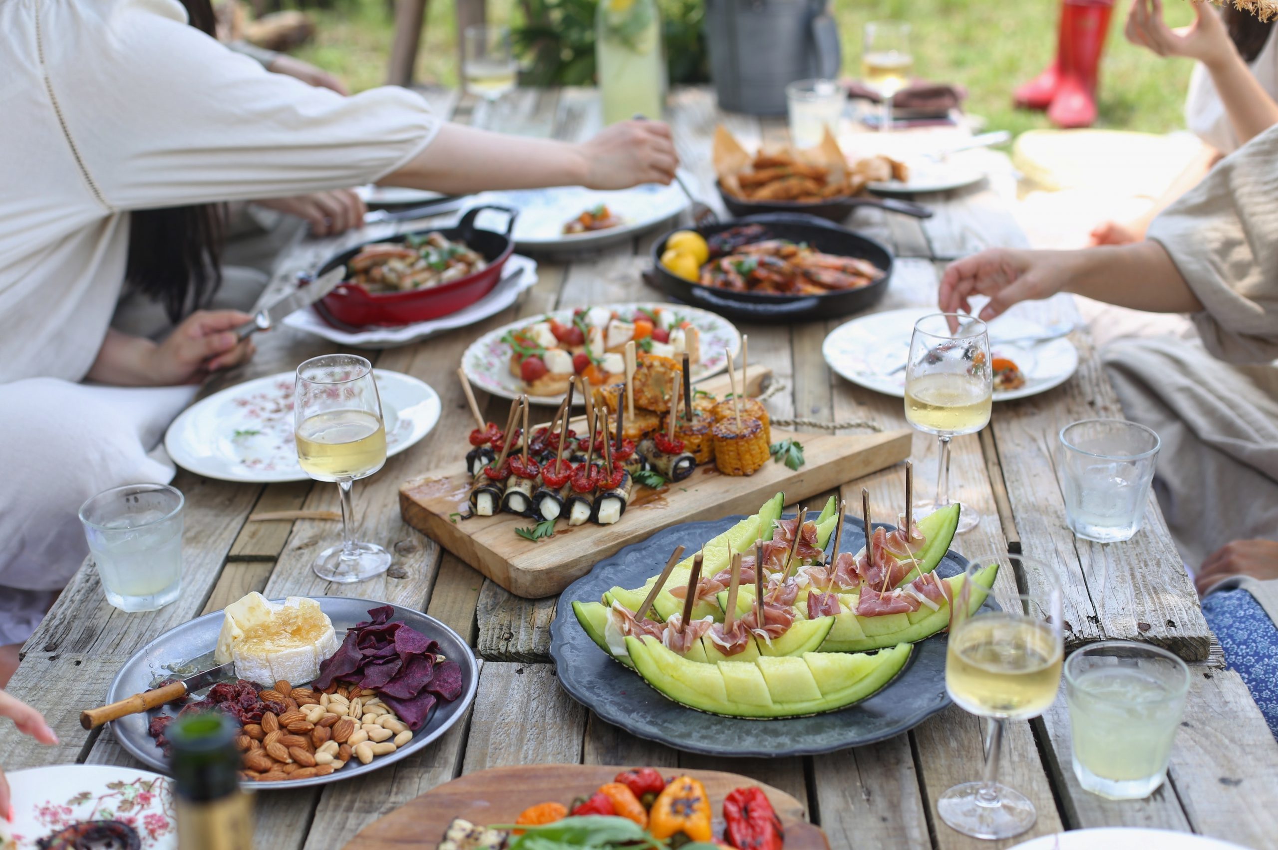 A feast of party food and drinks during a garden party.