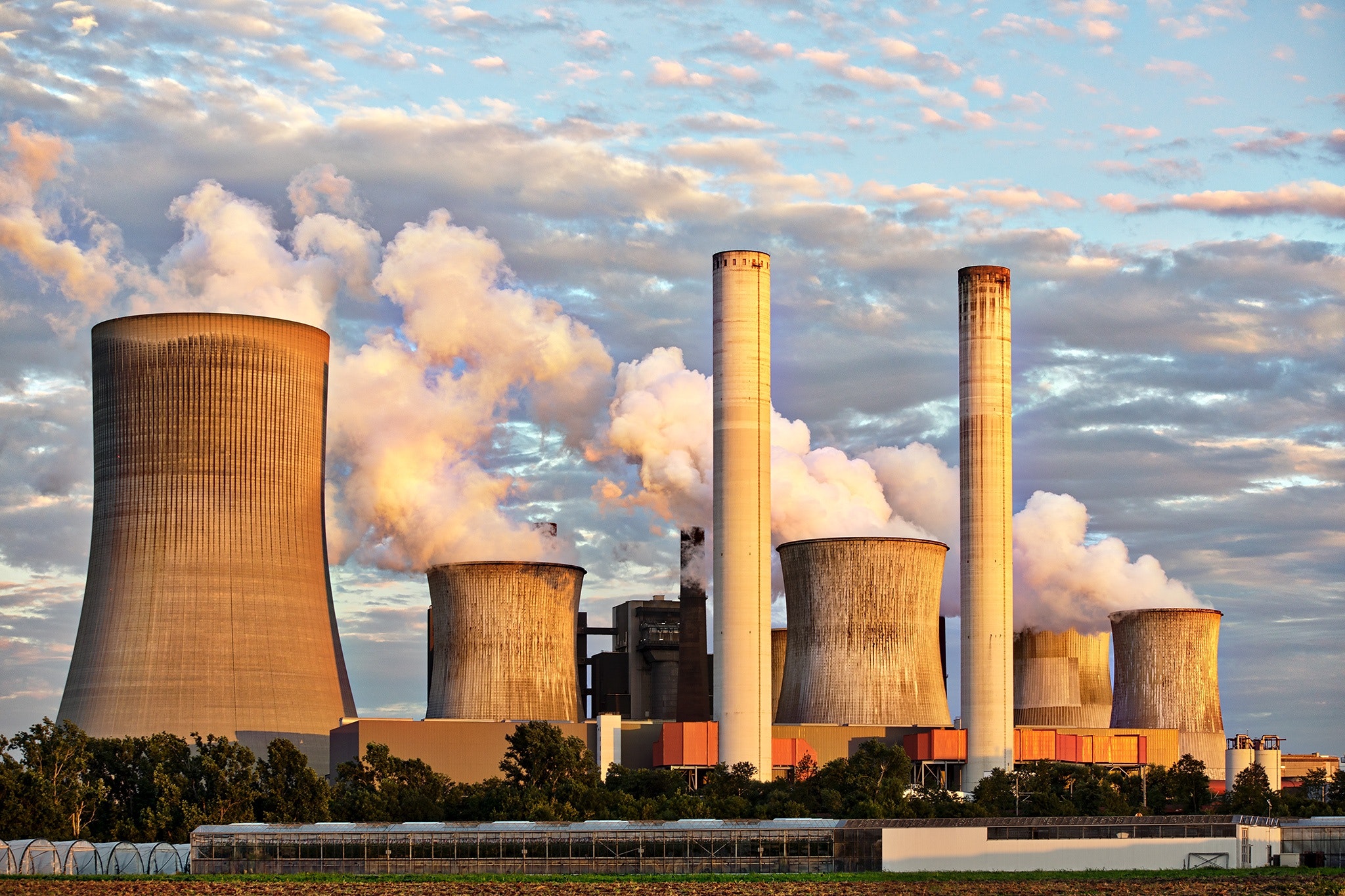 Plumes of smoke billowing from a chemical plant.