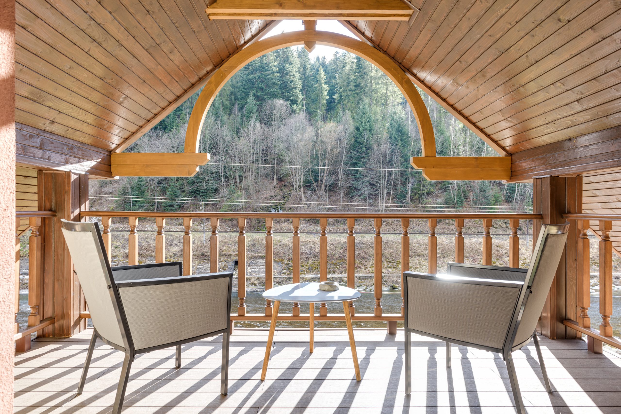 The scenic view from a patio with wooden flooring.