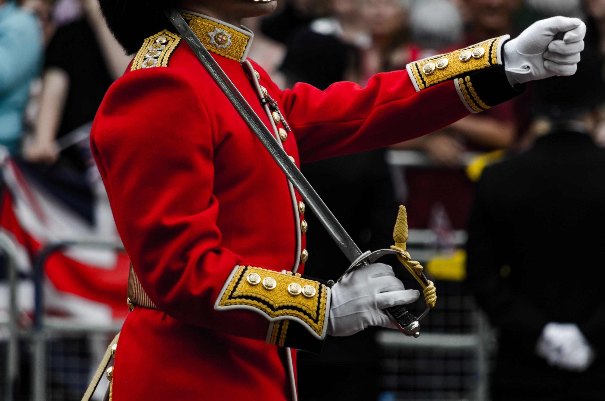 A soldier from The Queen's Guard marching in a parade.