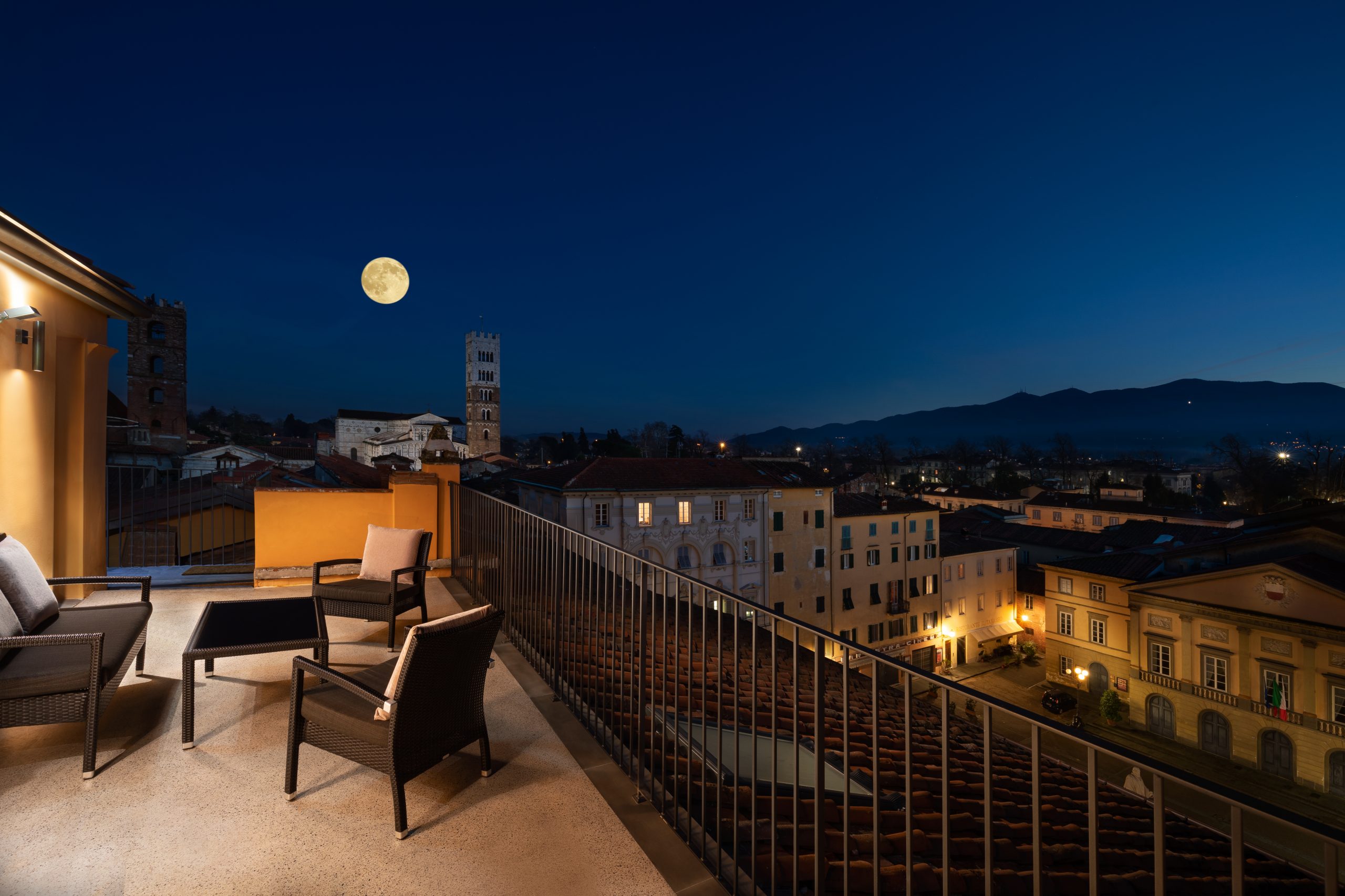 The moon rising over The Sommita Martin Orsyn Champagne Rooftop