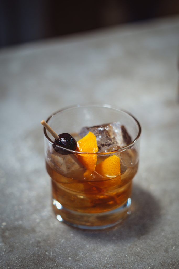 A Dubonnet Manhattan cocktail served at a bar.