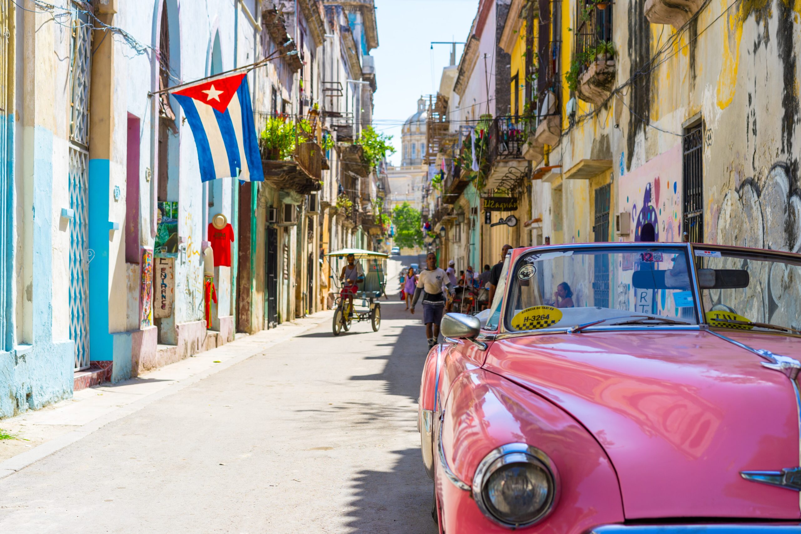 Pink convertible car on the streets of Cuba