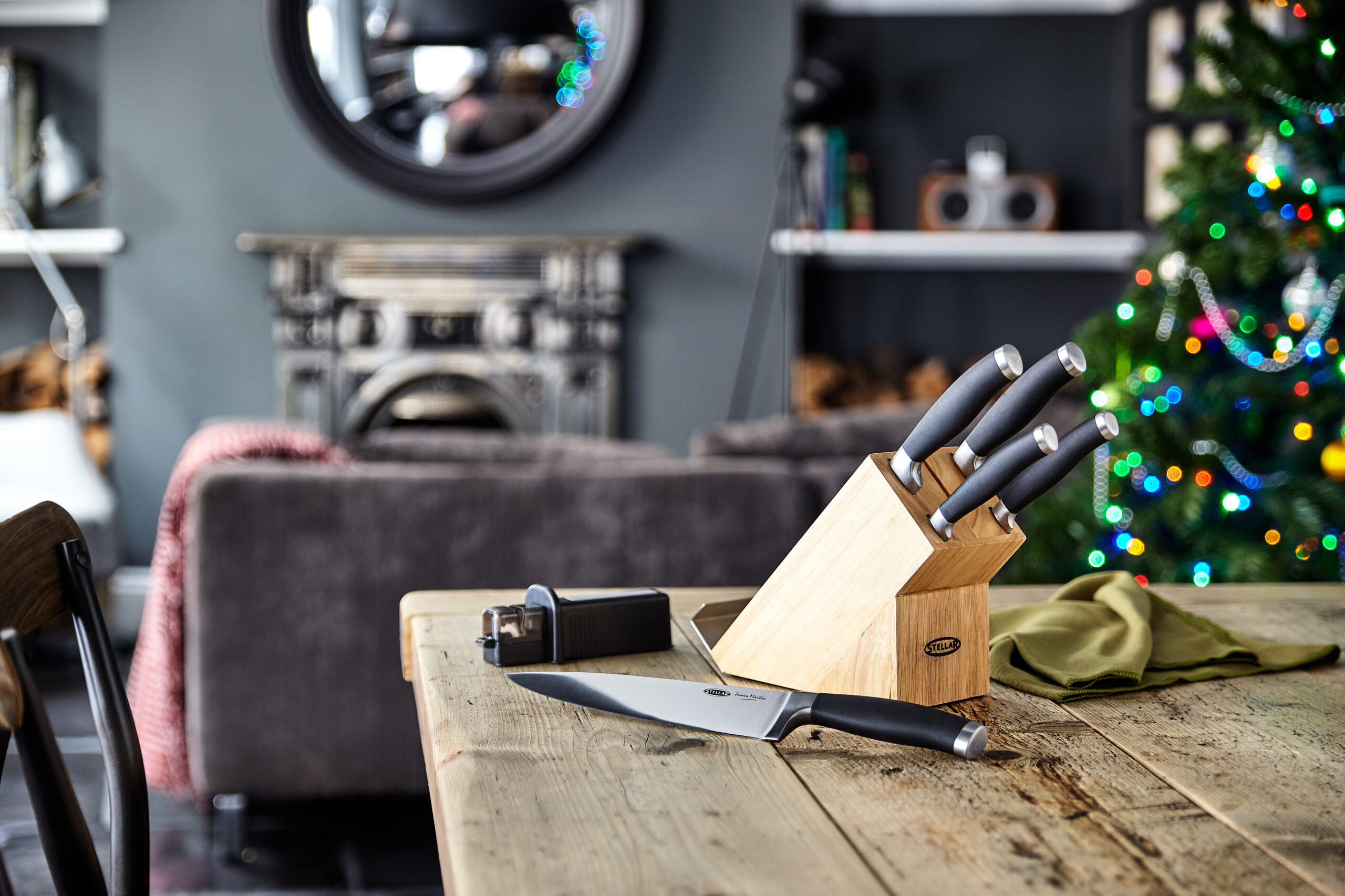 Professional knives on wooden table