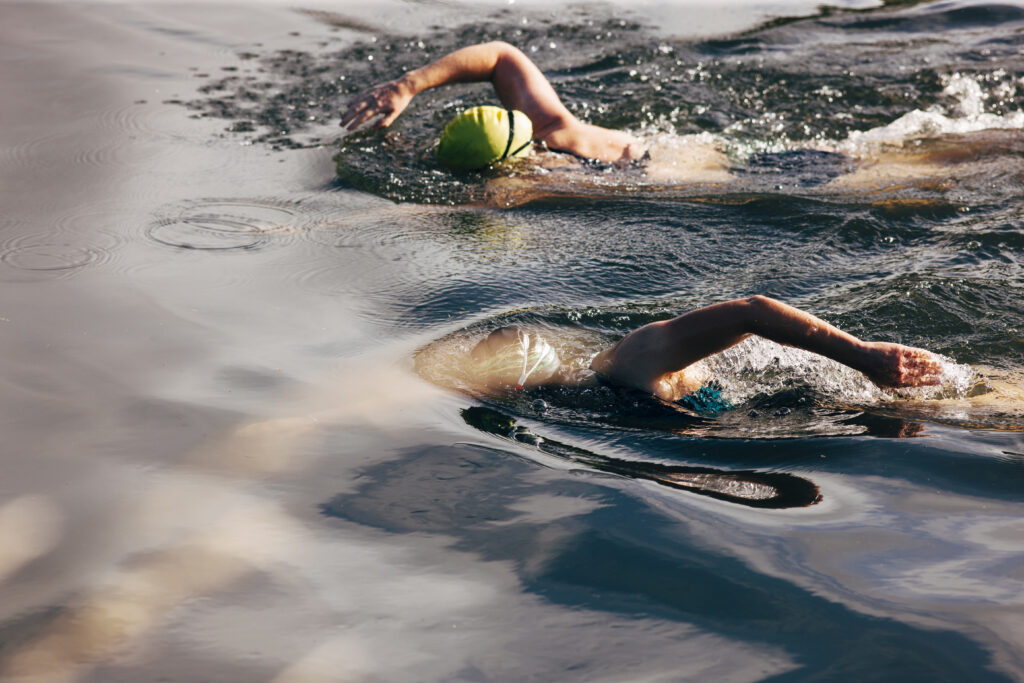 Two women wild river swimming at Monmouthshire, Wales.