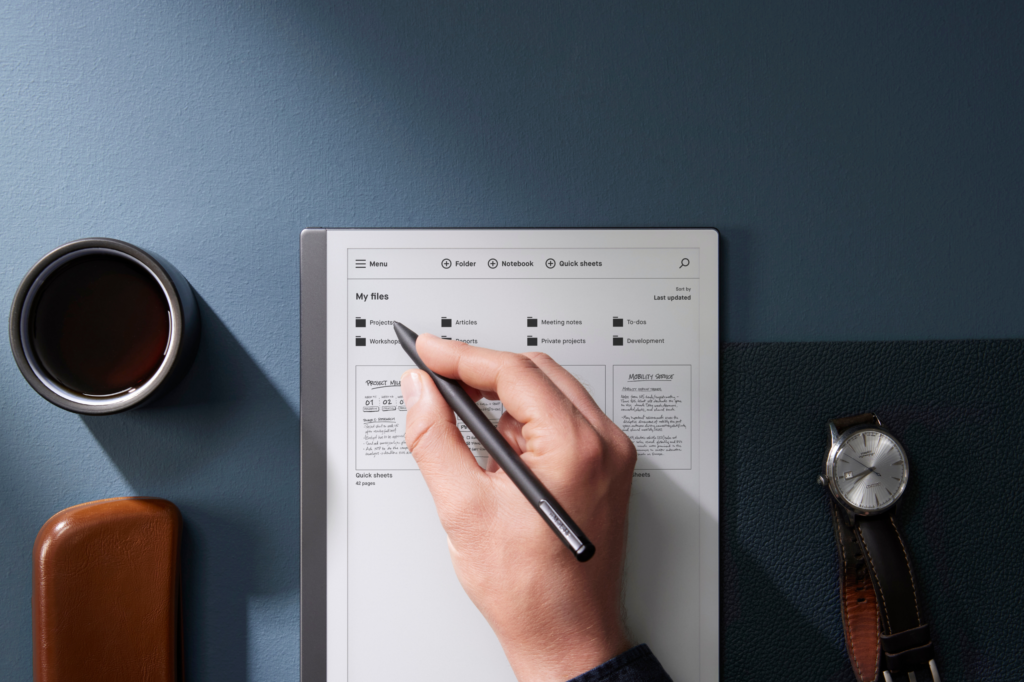 Overshot of a hand on a notebook with a checklist for a meeting.