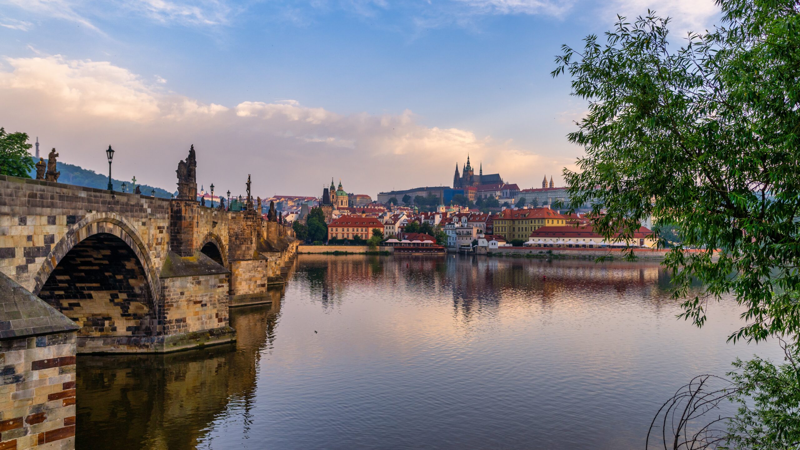 Looking across the river, the skyline of Prague in the magic hour.
