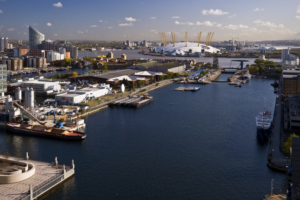 A bird's-eye view of London with the O2 arena as a prominent backdrop.
