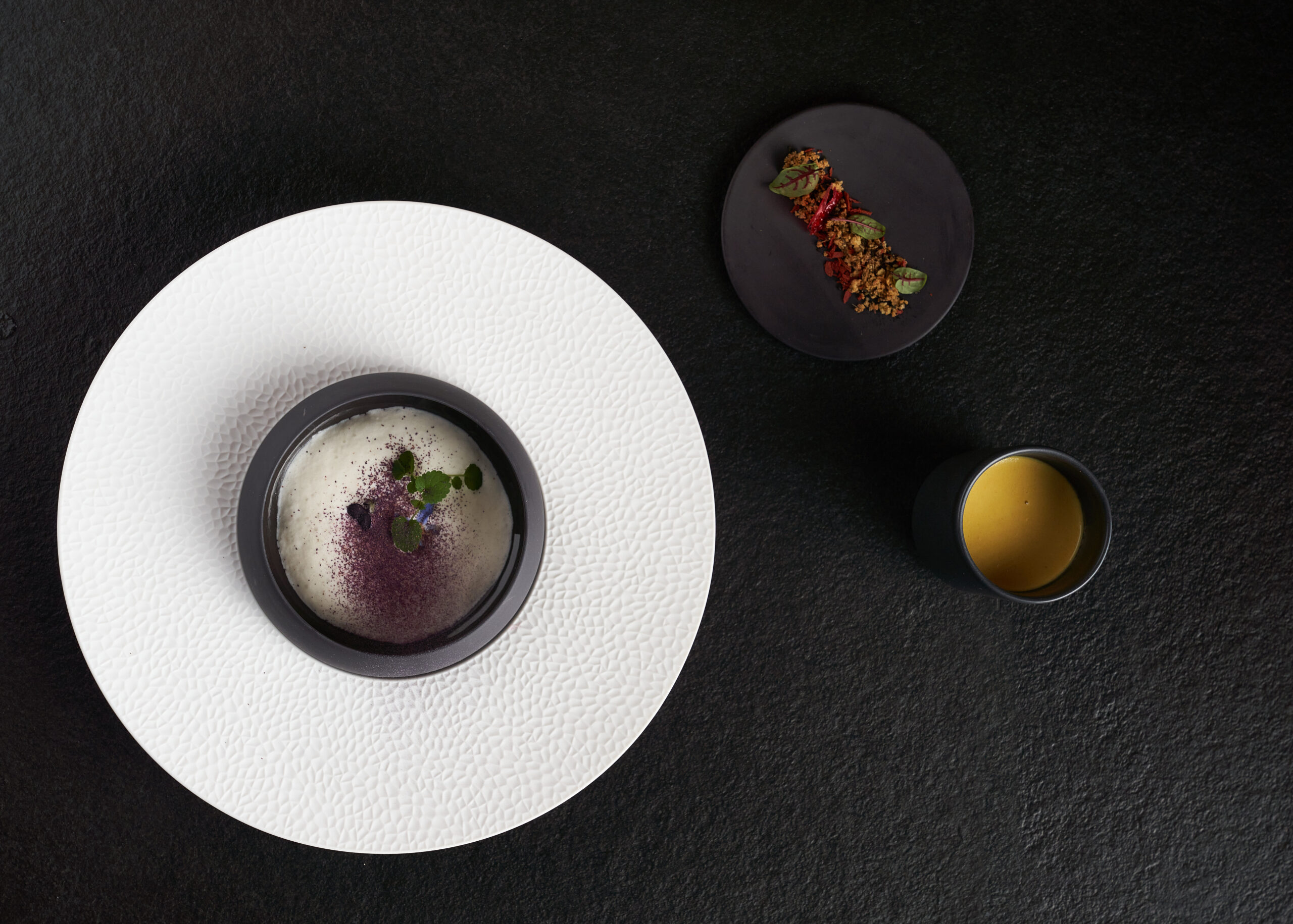 Fine dining dishes in minimalist black and white plates