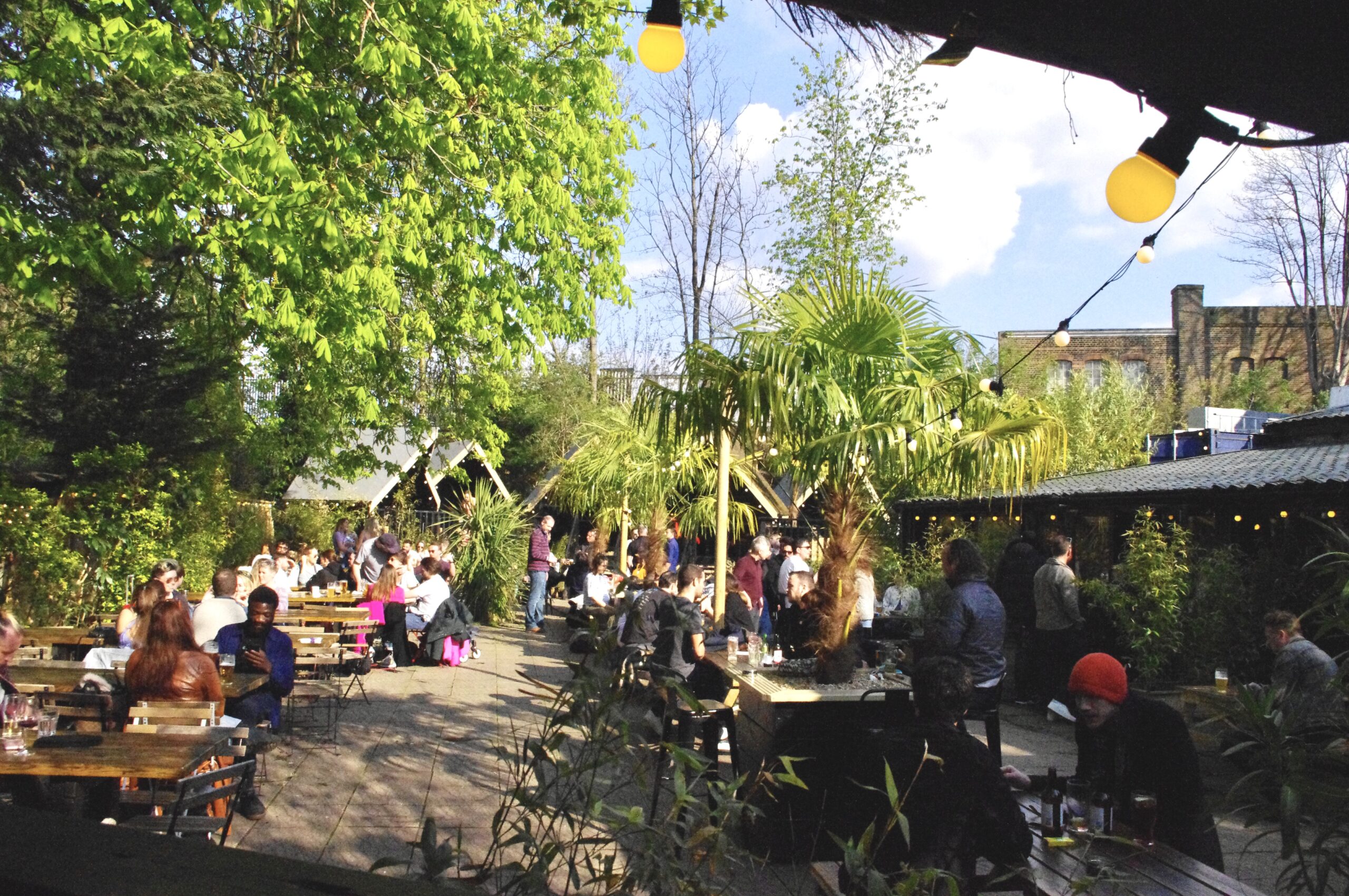 Pub garden with tables and huts