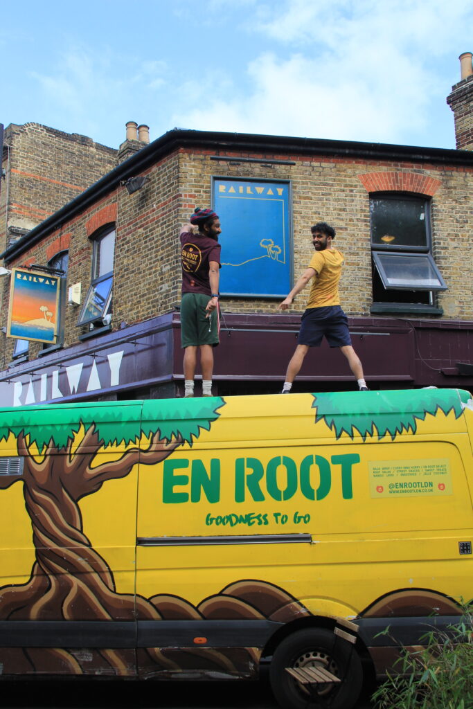 Harsh and Nish Modasia on top of their En Root truck