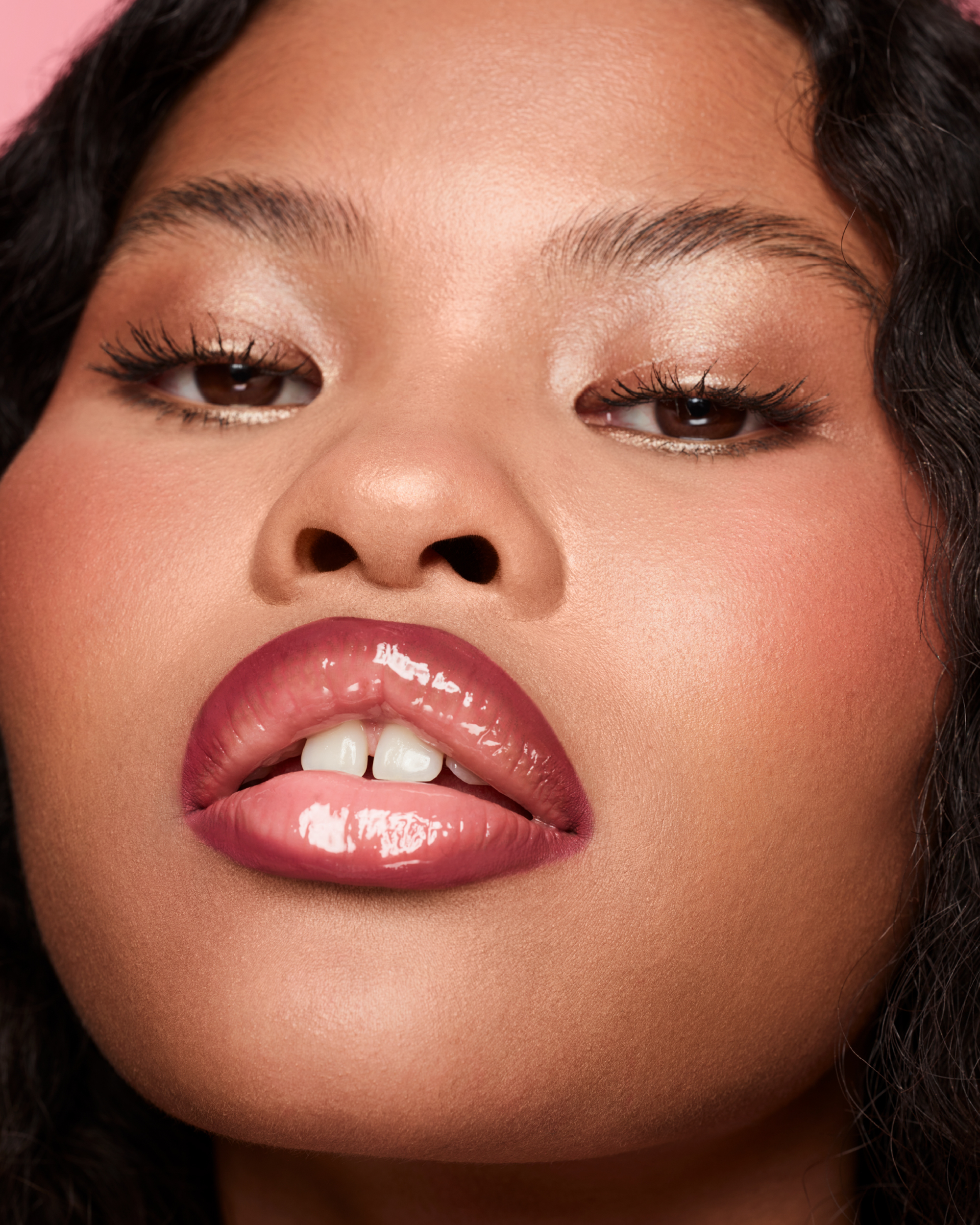 Close up of a black model's face with dark lip liner