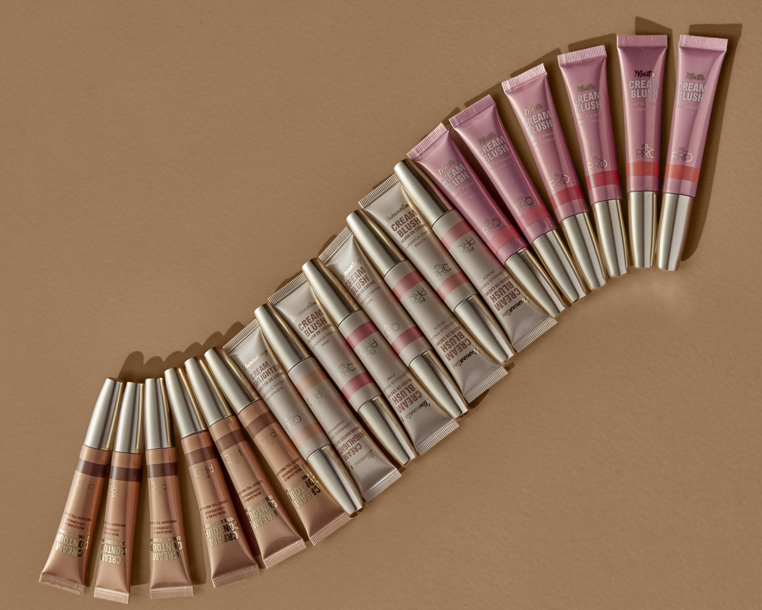 Primark Beauty highlight, blush and contour wands are stacked in a row creating a curved line 