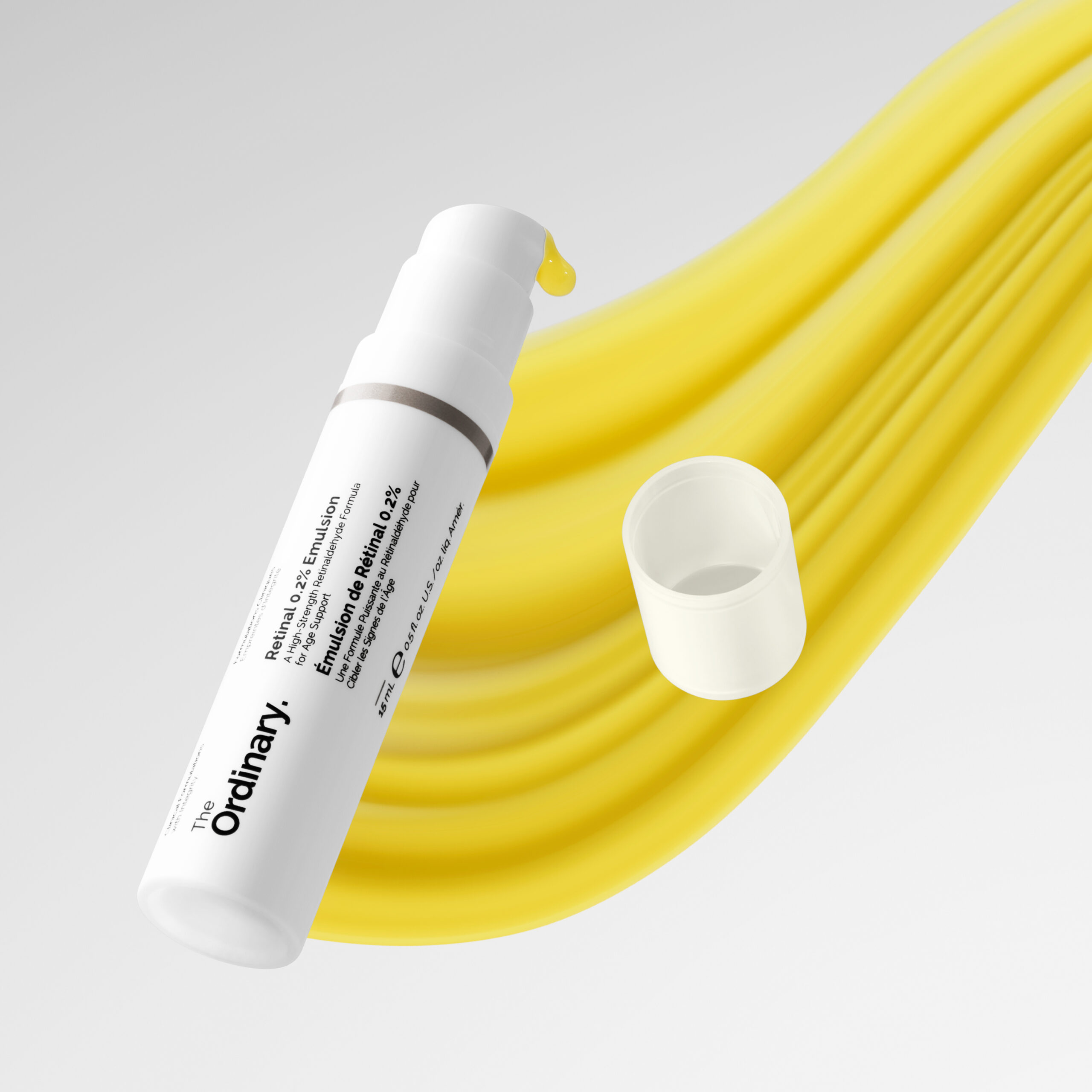 The Ordinary Retinal serum is placed on top of a yellow swoop representing the product