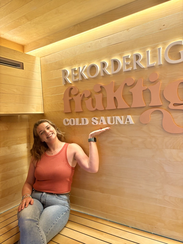 Evelyn Richards smiles in a cold sauna.