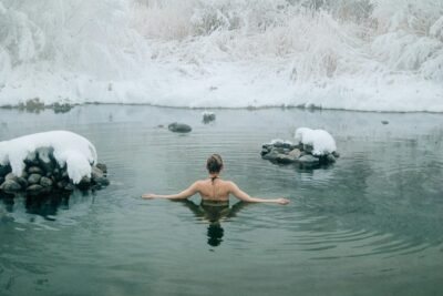 woman submerging in cold water therapy