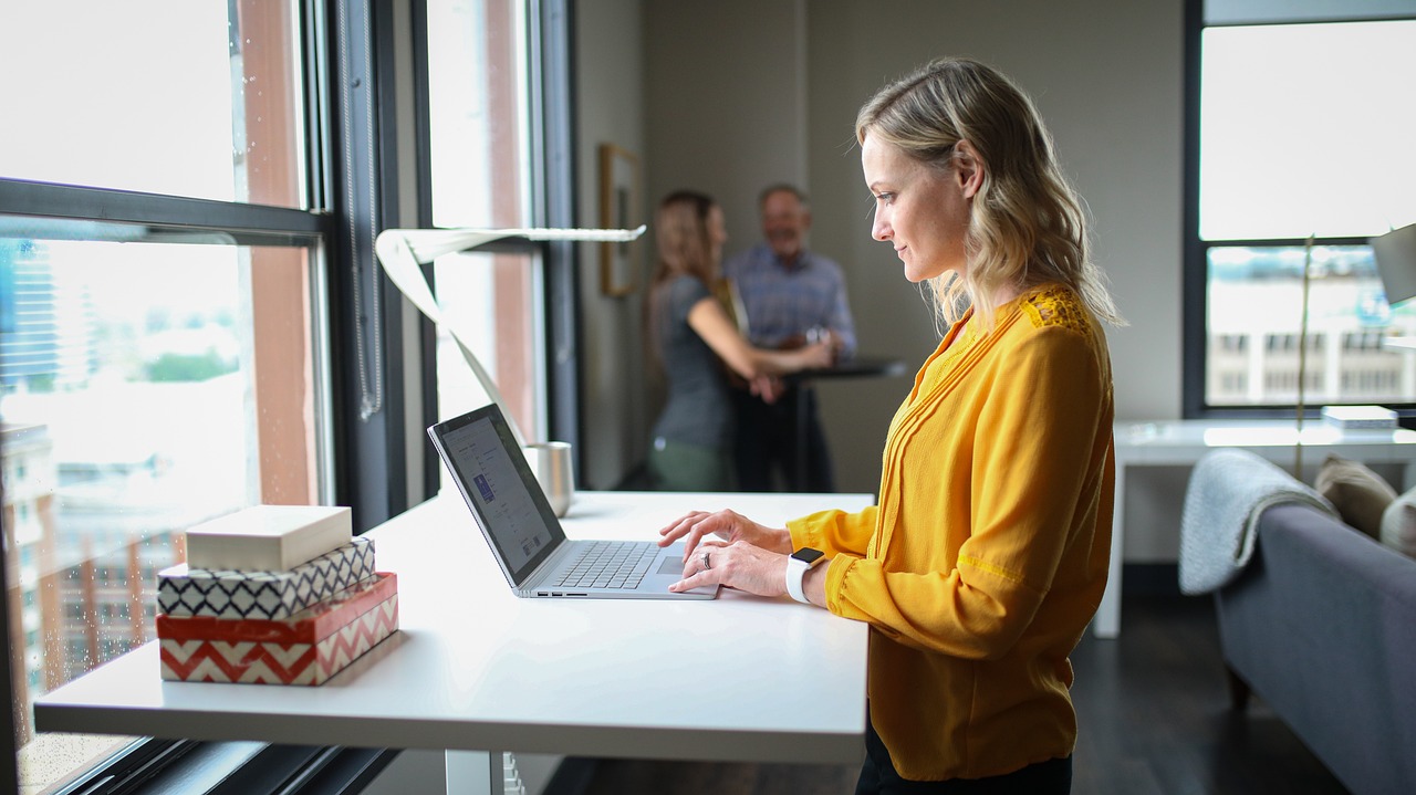 Woman works from a standing desk