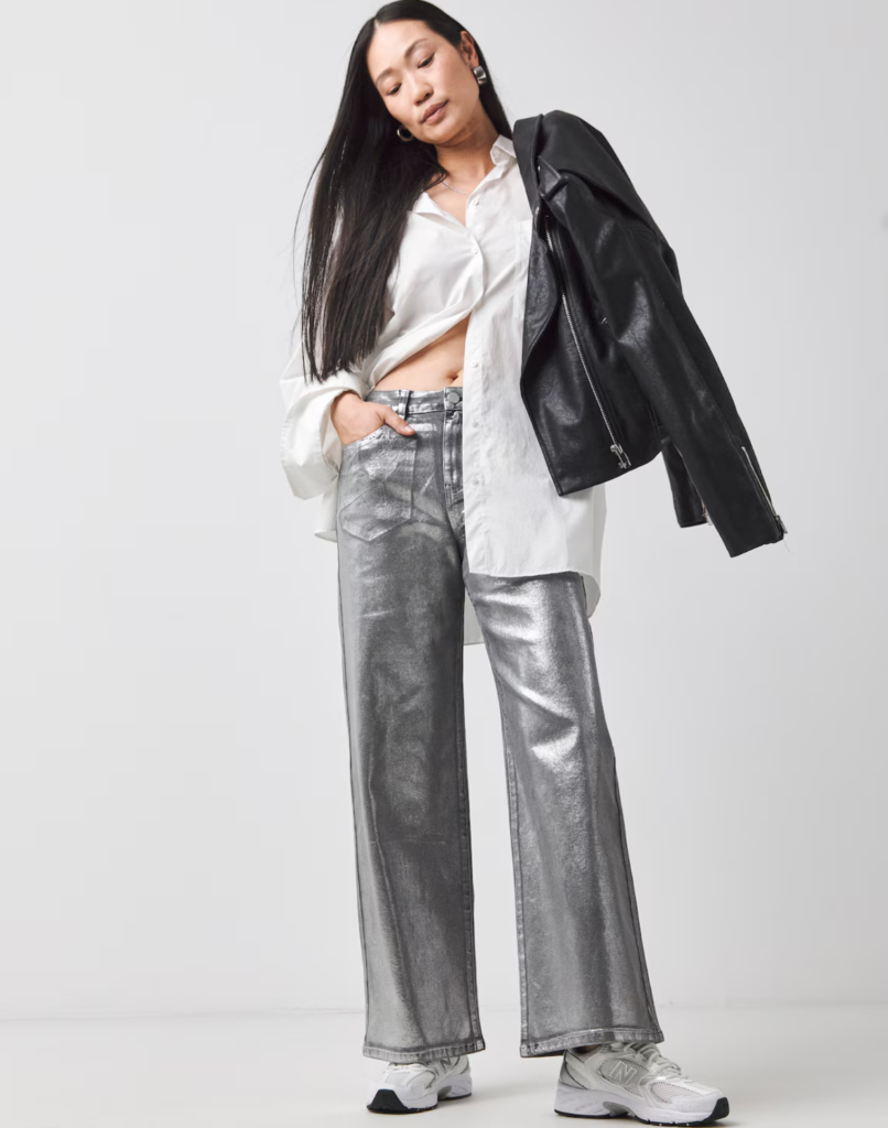 JD Williams model wears striking silver trousers