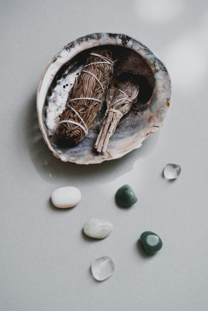 Sage bundle in a bowl with crystals