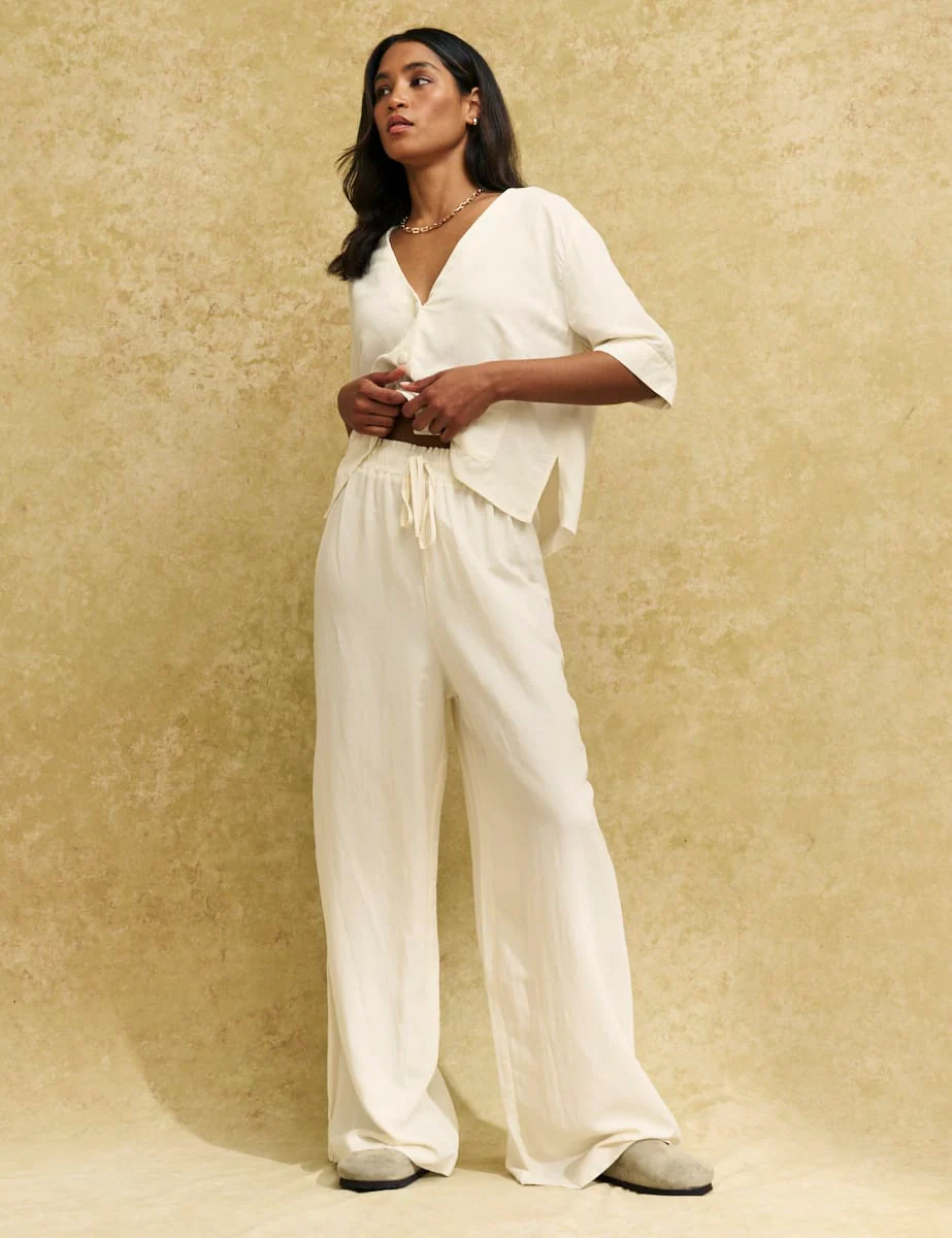 Model wears Nobody's Child linen trousers and matching loose top