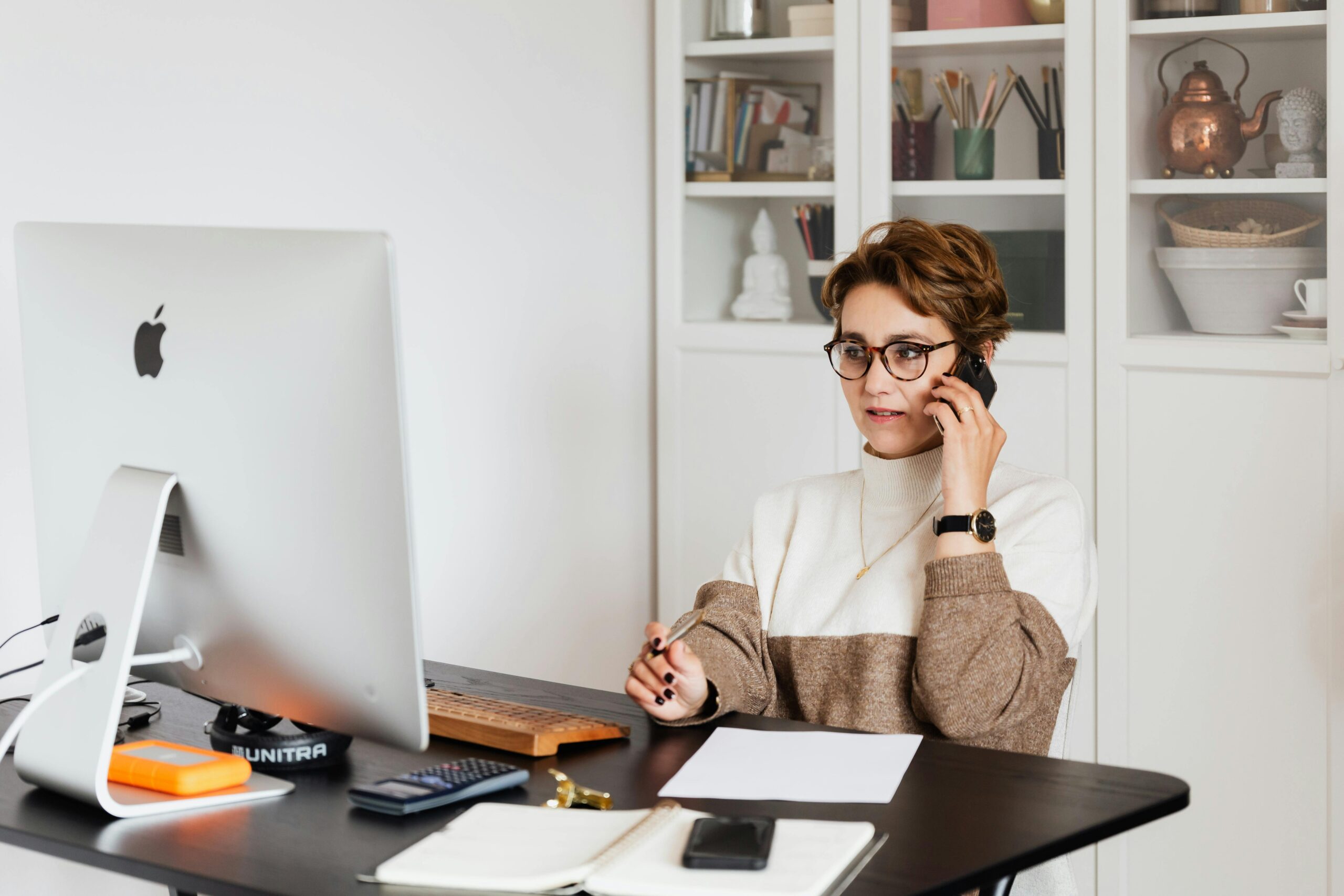 Woman wears glasses at her desk