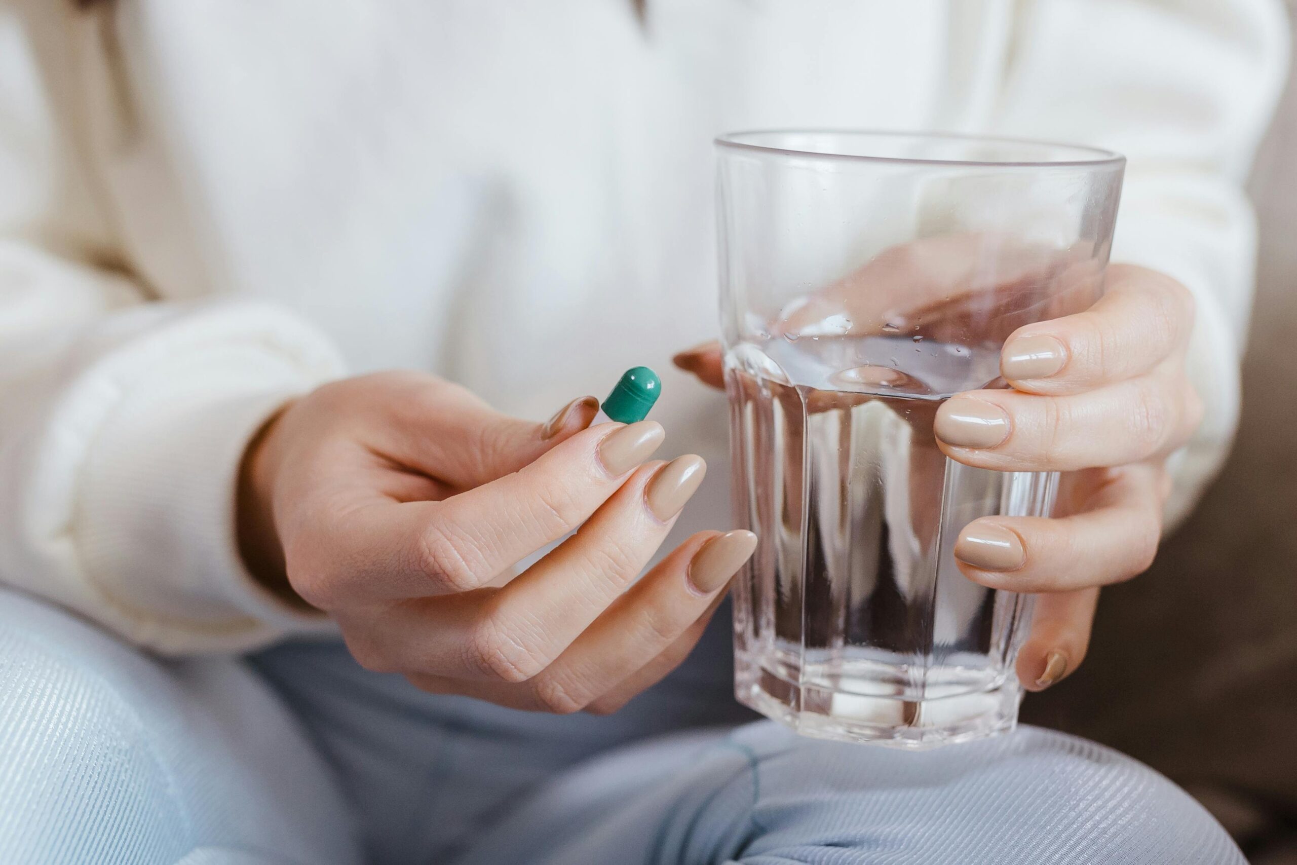 Woman takes a pill