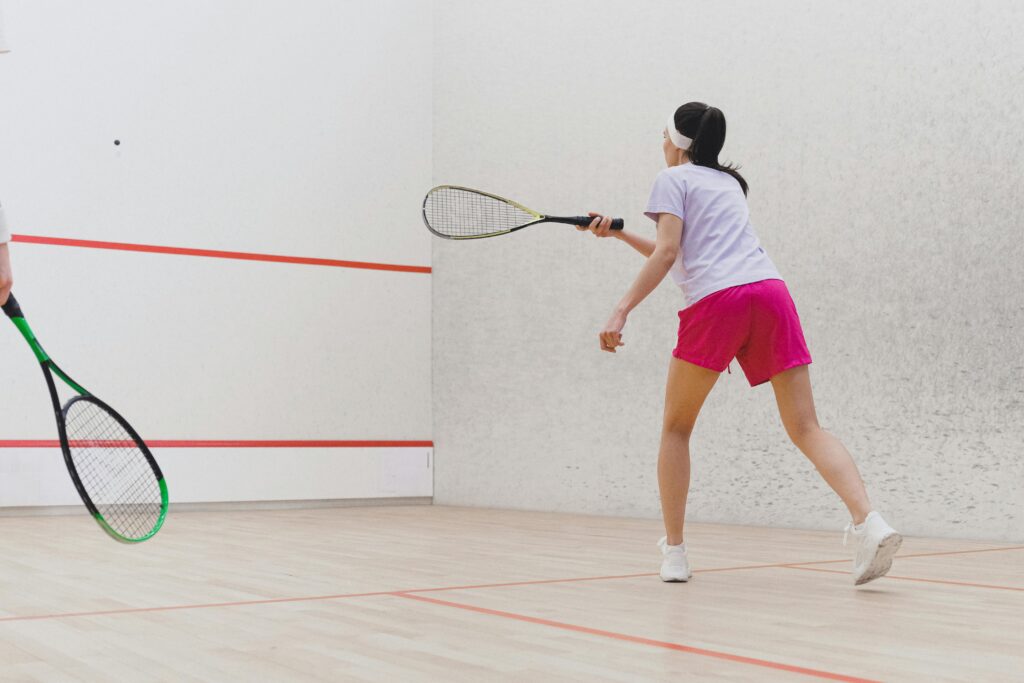 Women playing a game of squash 