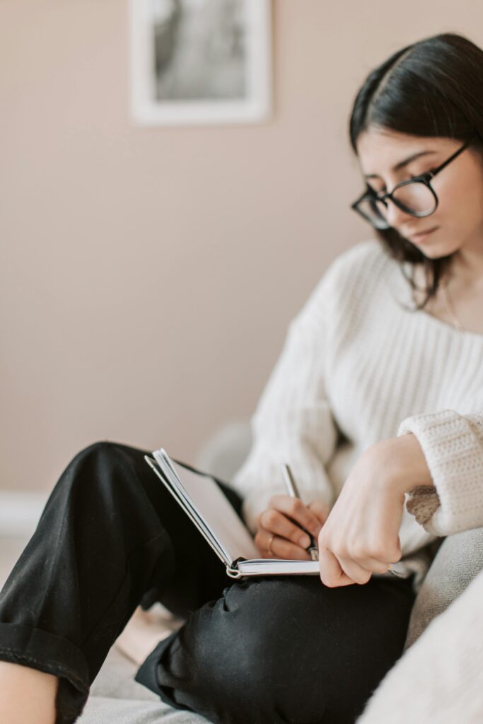 Woman writes in her journal