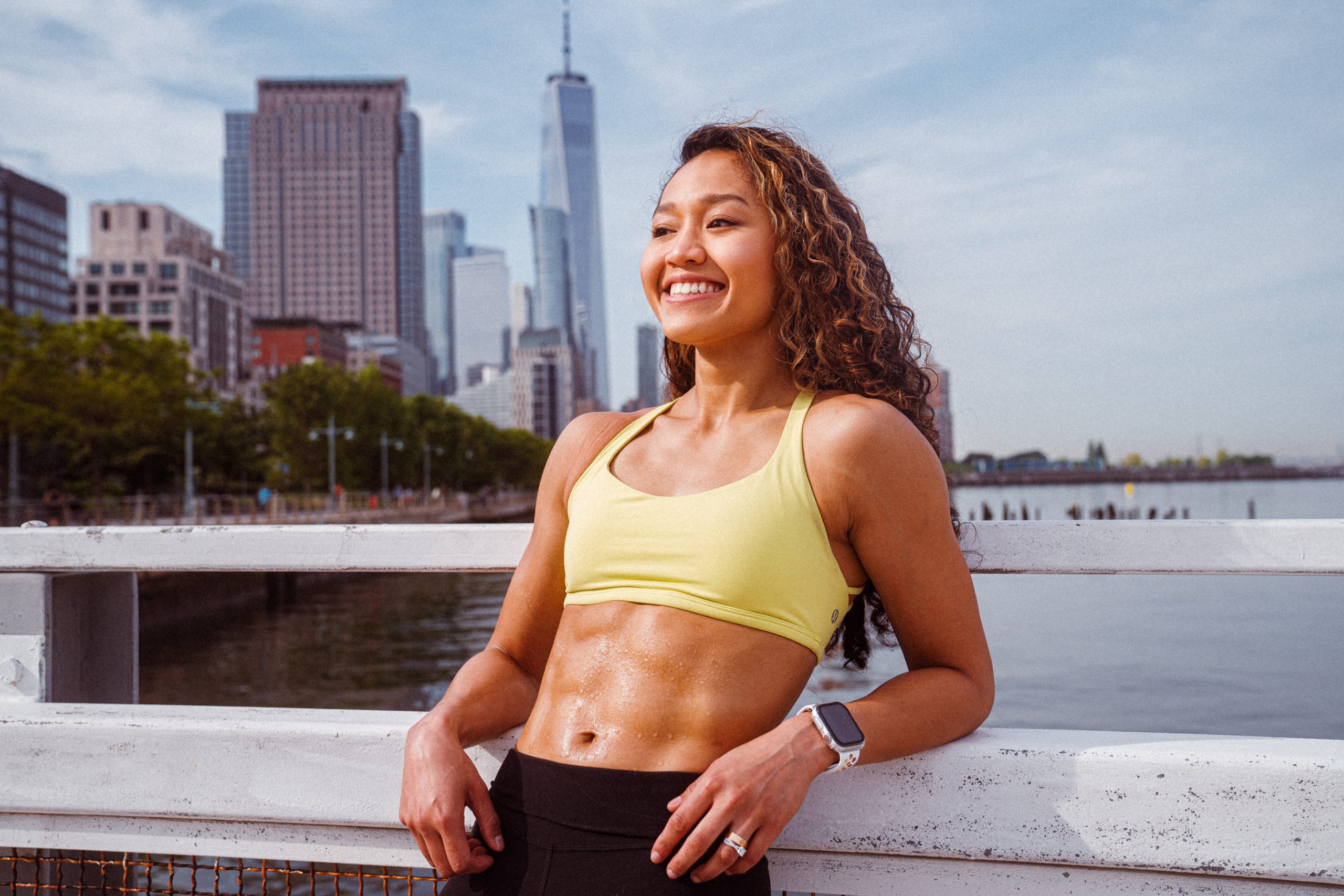 Woman relaxing after working out with a smartwatch