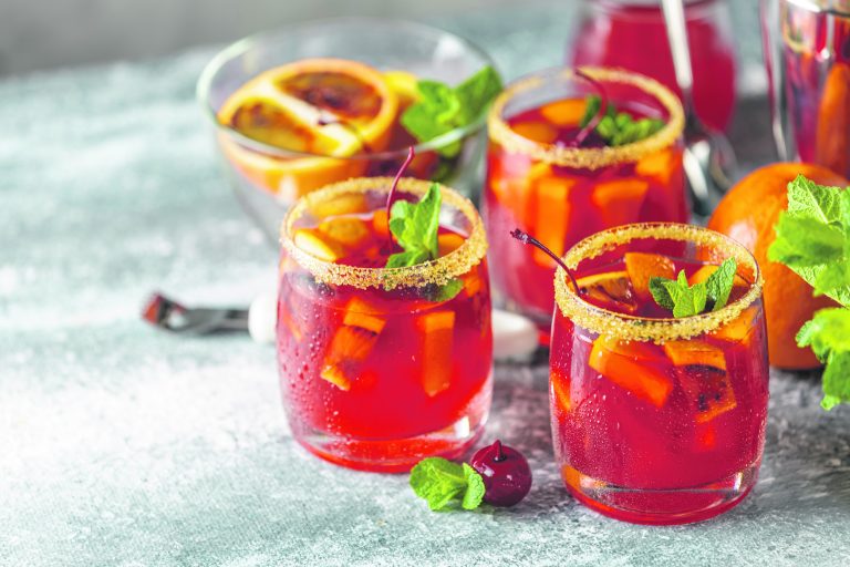 On the rocks with a slice of orange - the Campari Spritz cocktail.
