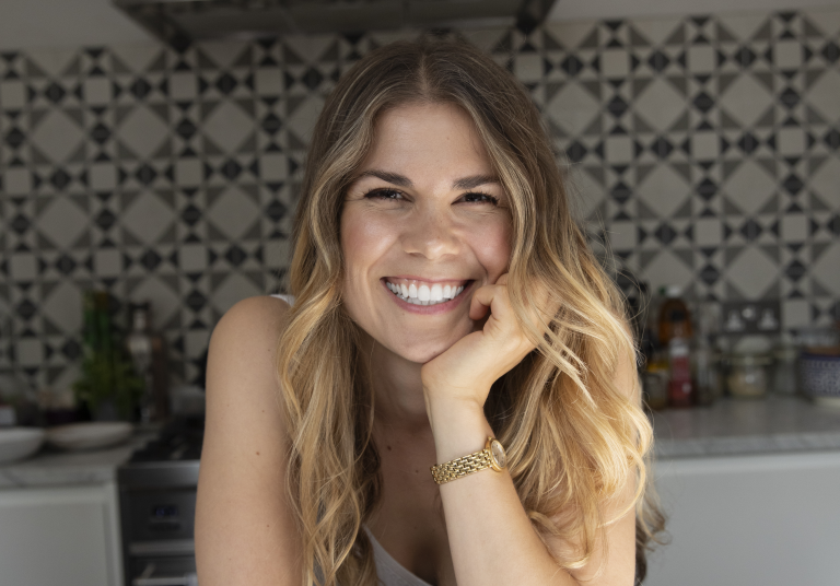 Madeleine Shaw promoting her Hair, Skin & Nails spray supplement.