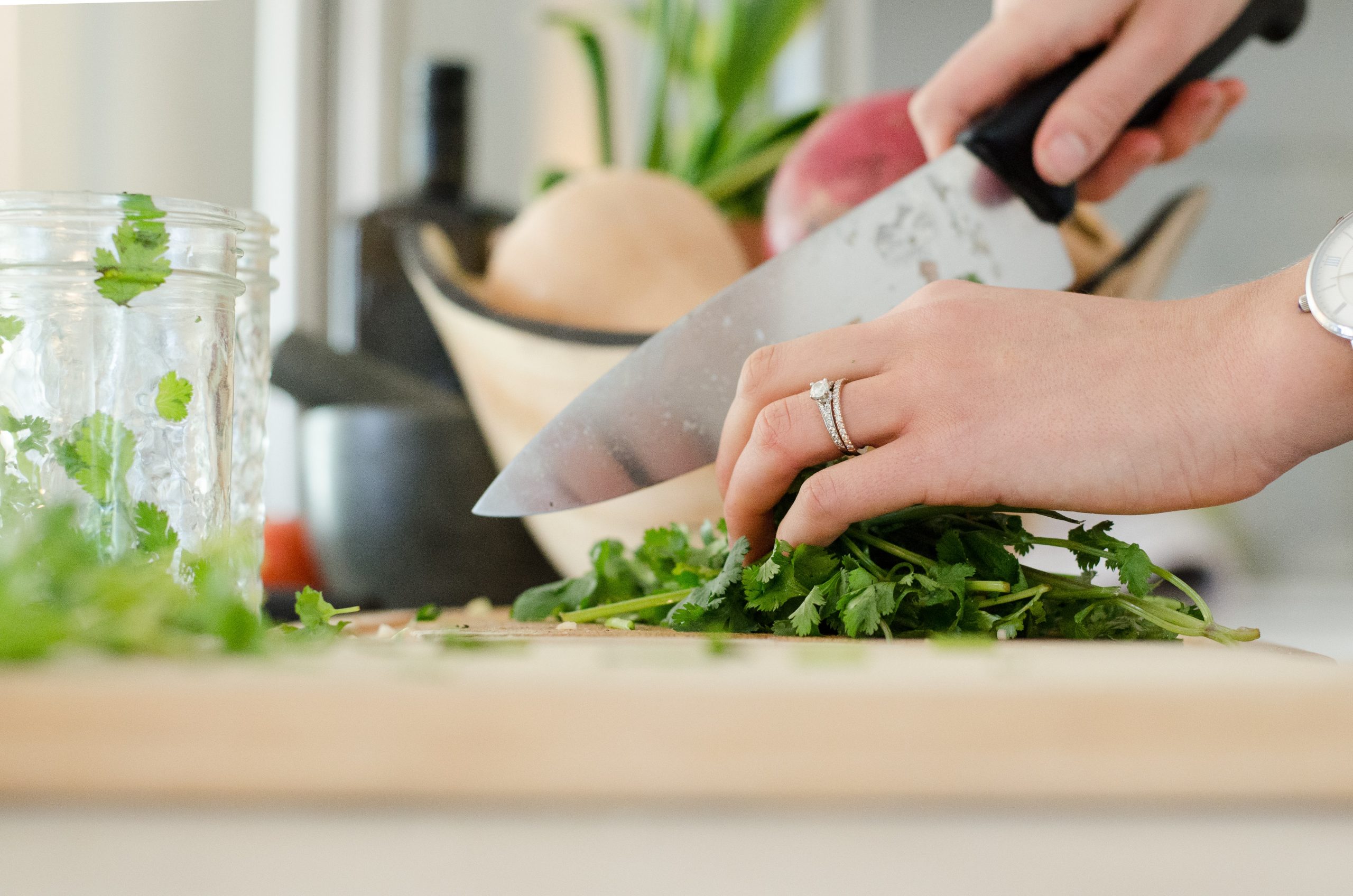 Preparing herbs and vegetables - leafy greens and gut health go hand-in-hand.