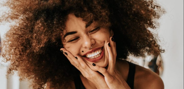 A woman smiling the perfect smile.