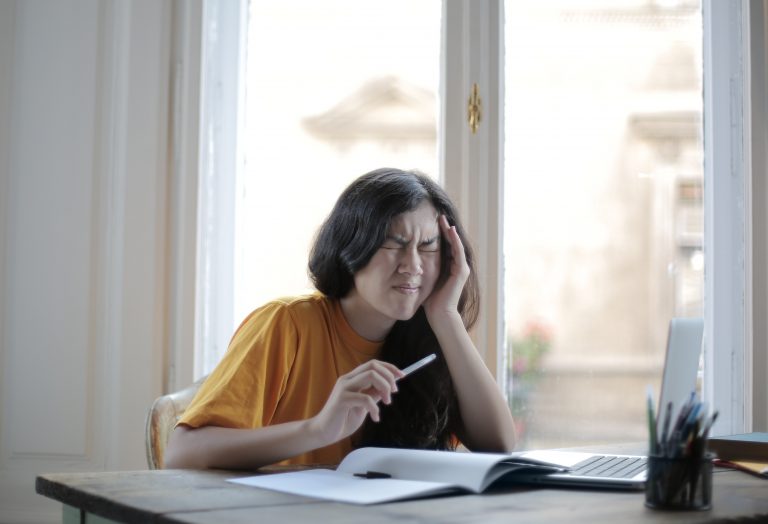 A woman suffering from a migraine