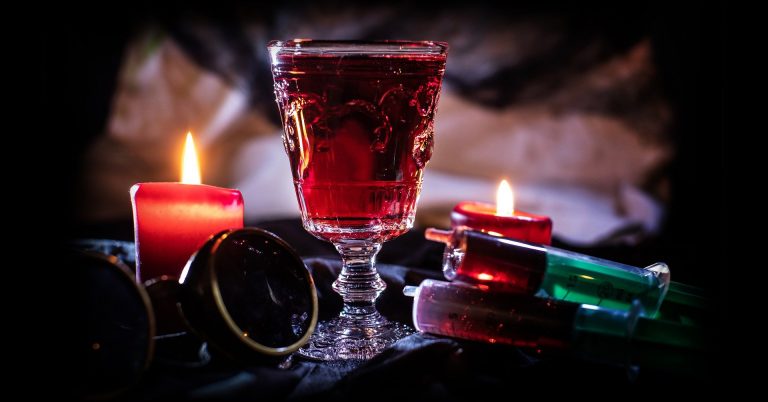 WitA Halloween-themed cocktail by candlelight.